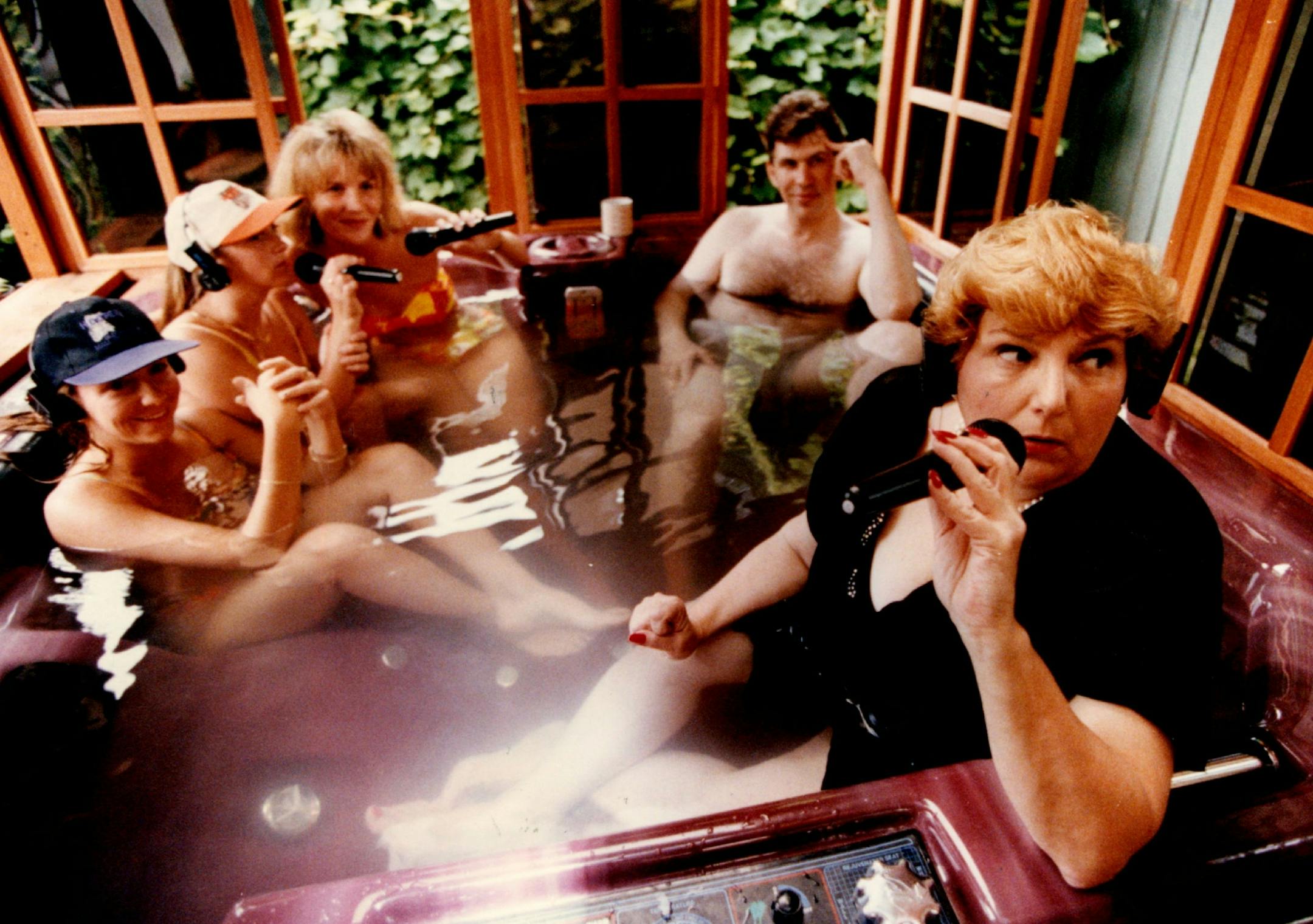 July 15, 1993 Barbara Carlson, morning talk show host (ess) os KSTP Talk radio does her thing in her hot tub at her home with women from HOOTERS, the restaurant and bar located in Bloomington MN. that is embroiled in a sexual harrassment suit. These women are from the other side and say they nave not experienced any harassment of any kind....left to right they are: Lisa, Steoganie and Shellie, the middle man is: Steve LaBeau, morning newsman for KSTP talk radio. July 20, 1993 Stormi Greener , Mi