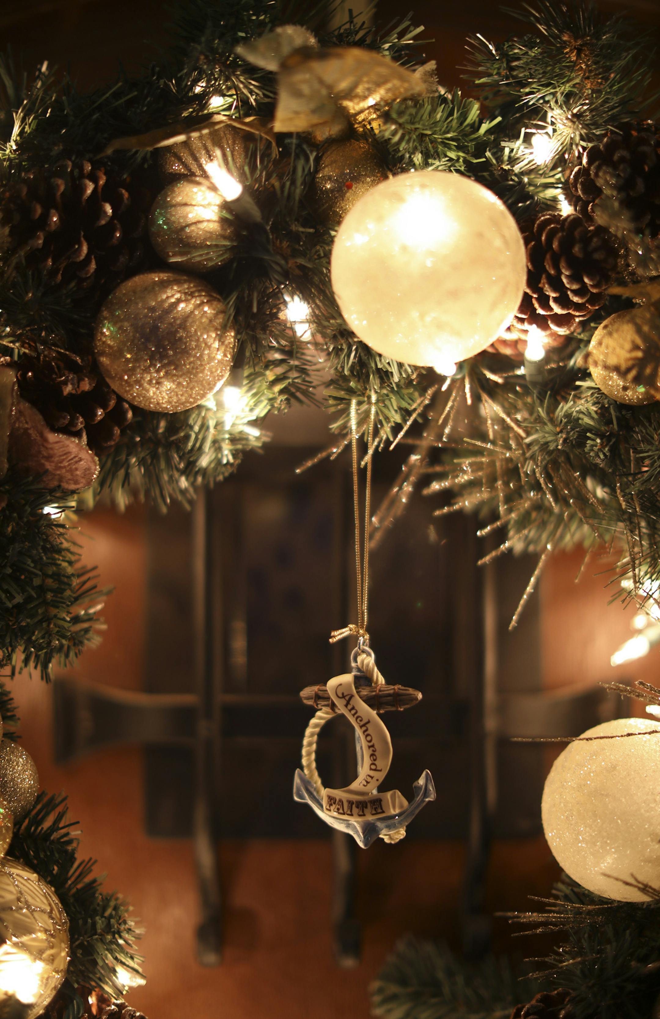 The wreath on the front door of Renee Carlisle's house is decorated with an ornament that says "Anchored in Faith."