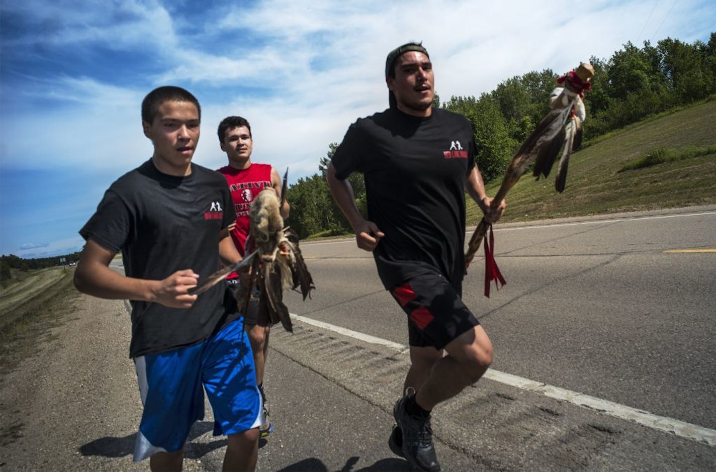 Several runners including Louis Jourdain, far right, are part of a relay team in the Red Lake Chemical Health 21st Annual Anishinaabe Spirit Run which brings awareness of substance abuse to several Northern tribes.