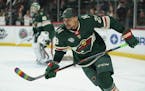 Wild right wing J.T. Brown was among several players who warmed up with stick blades taped with rainbow colors on the night of the Wild's annual "Hock