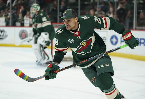 Wild right wing J.T. Brown was among several players who warmed up with stick blades taped with rainbow colors on the night of the Wild's annual "Hock