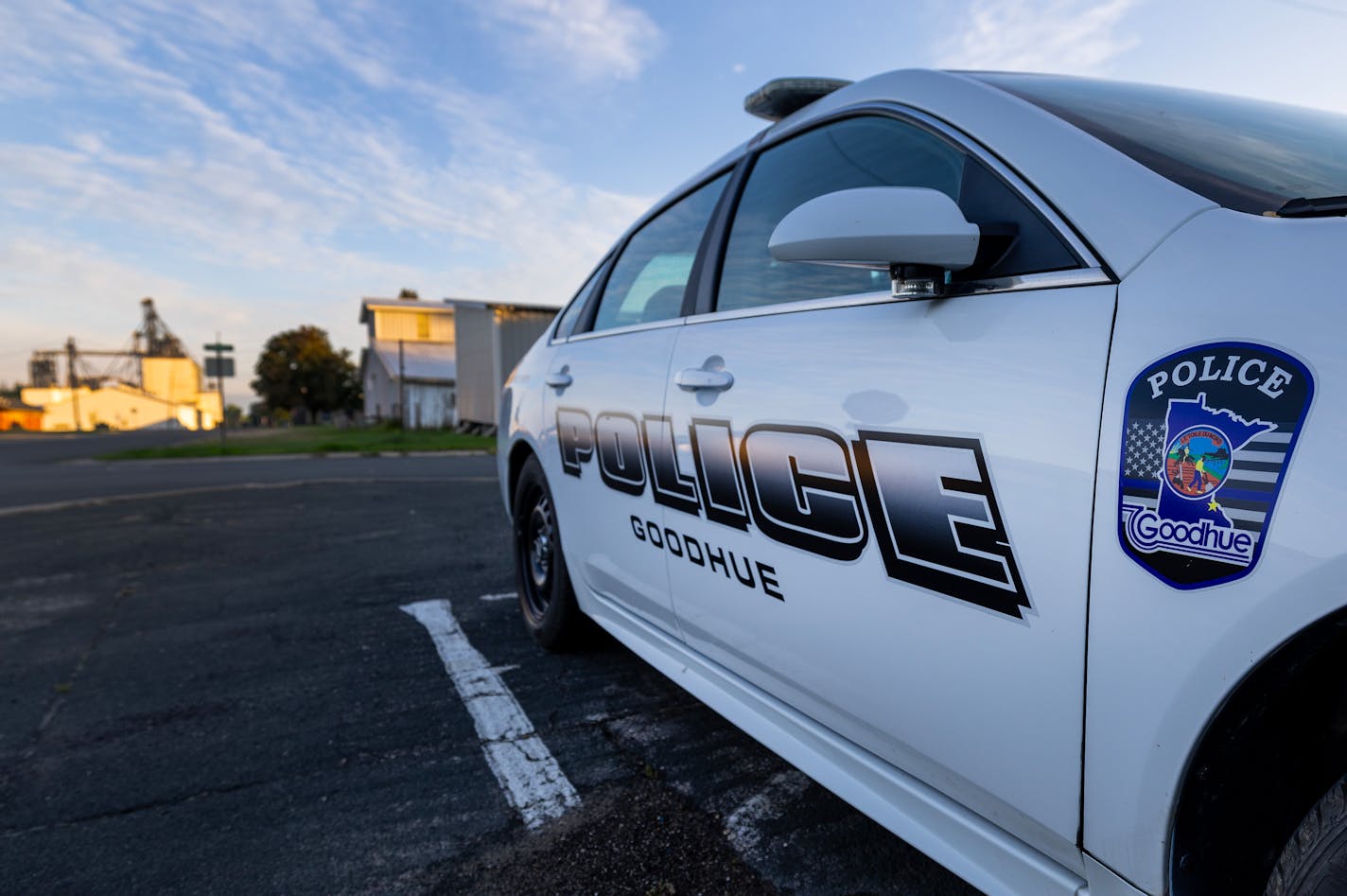 A parked Goodhue police car Monday, August 14, 2023, at Goodhue City Hall in Goodhue, Minn. The Goodhue city council met for a special meeting to address the police department in Goodhue Monday. The police department in Goodhue quit last week after an Aug. 9 city council meeting. The police chief, Josh Smith, and one other officer will stay on until Aug. 23. ] CARLOS GONZALEZ • carlos.gonzalez@startribune.com