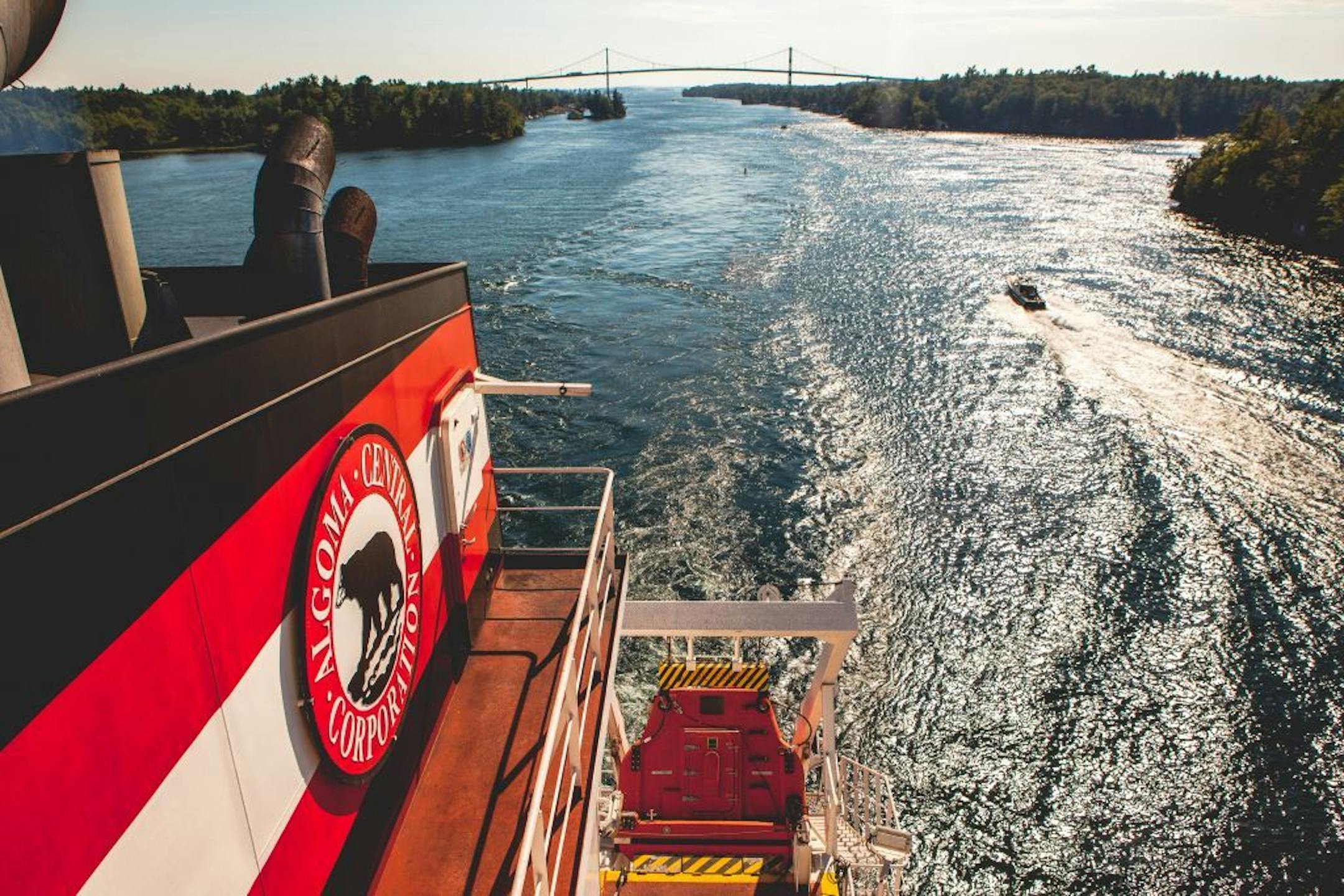 The Algoma Equinox passes the 8.5-mile Thousand Islands Bridge on the Saint Lawrence River.