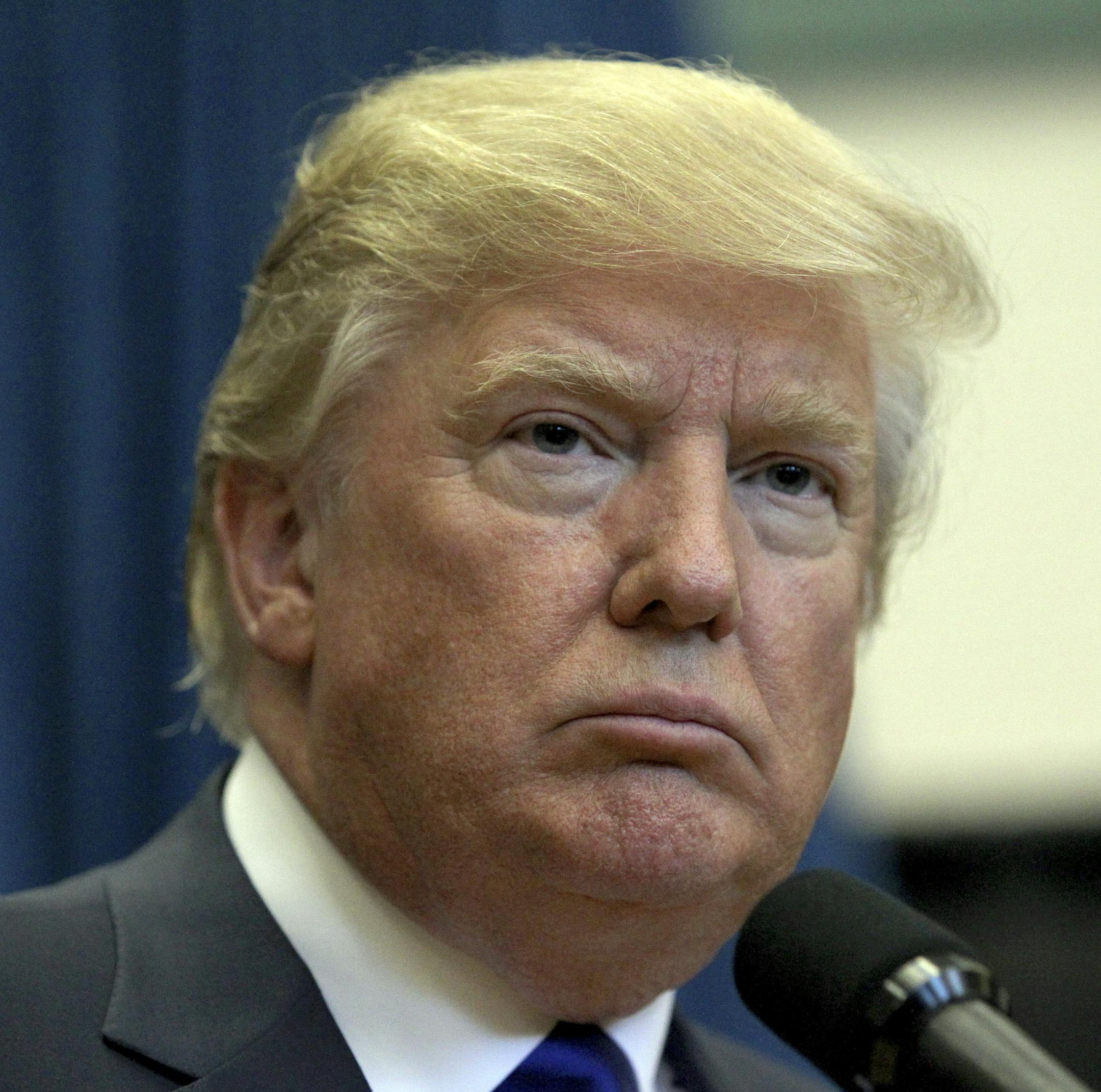 Republican presidential candidate businessman Donald Trump listens to a question from the media during an availability before his public event, Wednesday, Aug. 19, 2015, at Pinkerton Academy in Derry, N.H. (AP Photo/Mary Schwalm)