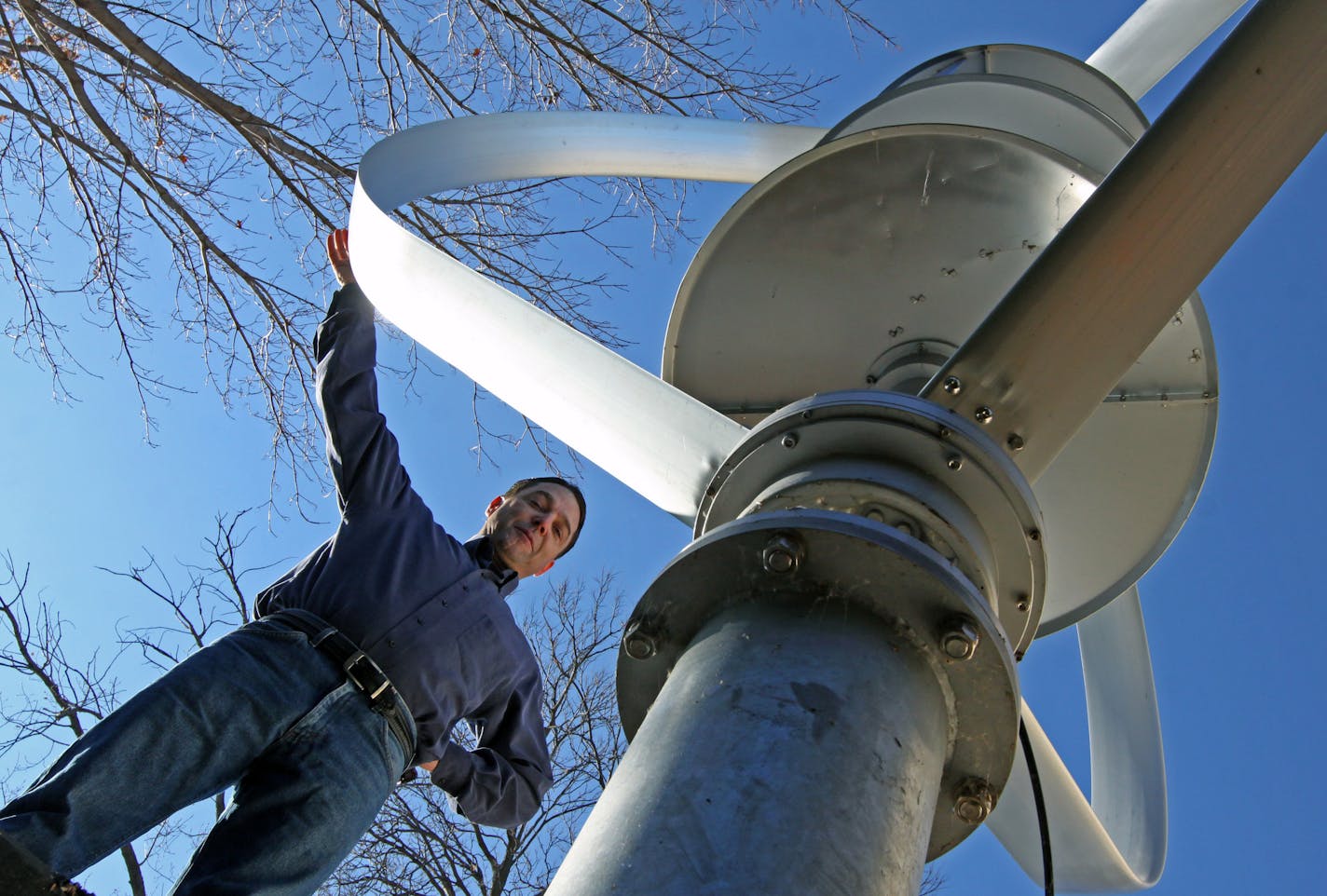 Jay Nygard has erected a wind turbine that resembles a huge egg beater at the rear of his house on Lake Minnetonka in Orono. His effort to go green has landed hime in a court battle with the city of Orono over construction of the wind turbine. He was photographed on 11/17/11.] Bruce Bisping/Star Tribune. May Nygard/source.