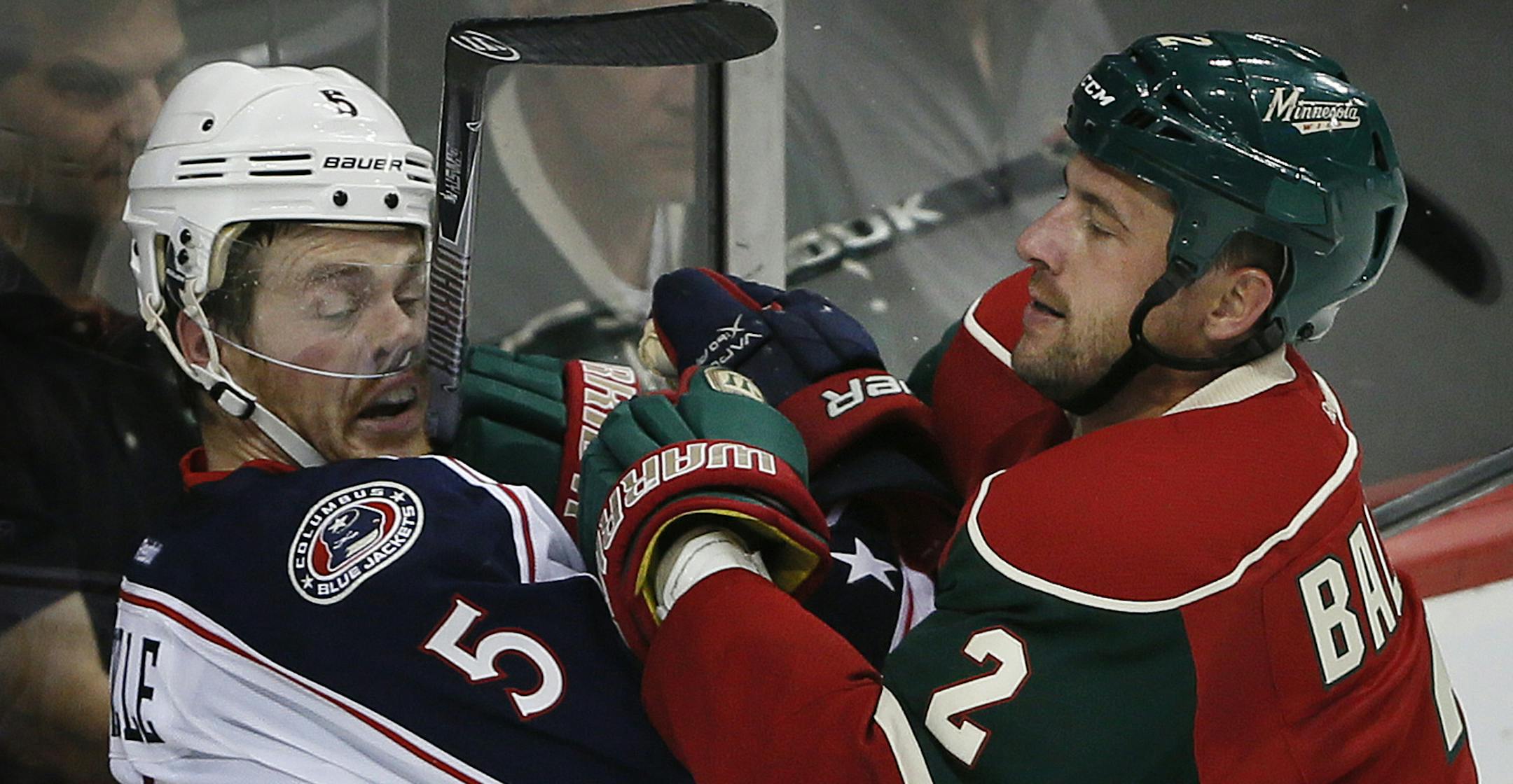 Minnesota Wild defenseman Keith Ballard (2) hit Columbus Blue Jackets right wing Jack Skille (5) on the glass in the second period during NHL action between the Minnesota Wild and the Columbus Blue Jackets September 17, 2013 at Xcel Energy Center in St. Paul, MN. ] JERRY HOLT ‚Ä¢ jerry.holt@startribune.com