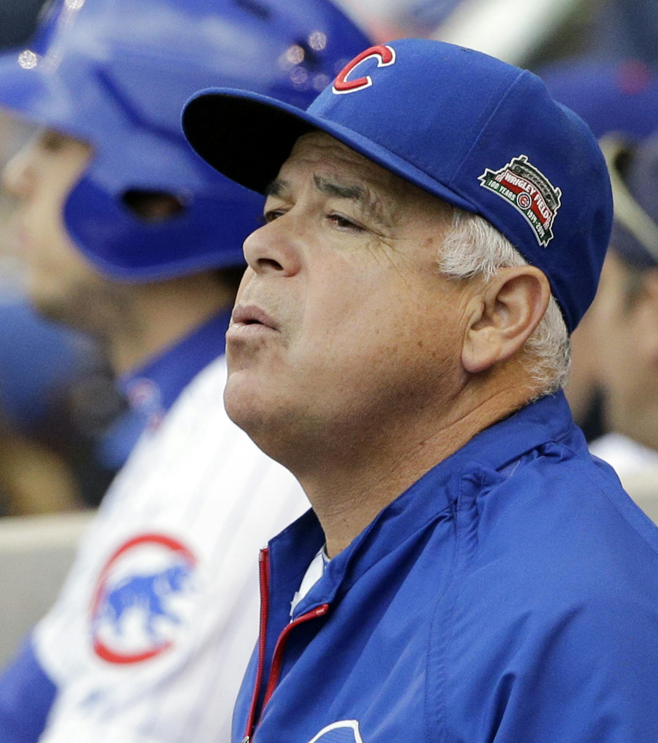 FILE - In this Sept. 21, 2014, file photo, Chicago Cubs manager Rick Renteria reacts as he watches his team during the first inning of a baseball game against the Los Angeles Dodgers in Chicago. The Cubs have fired Renteria after one season to pursue former Tampa Bay manager Joe Maddon. Team President Theo Epstein said Friday, Oct. 31, 2014, that Renteria deserved to come back next season as the Cubs continue their rebuilding effort. But Maddon opted out of his contract with the Rays and Epstein