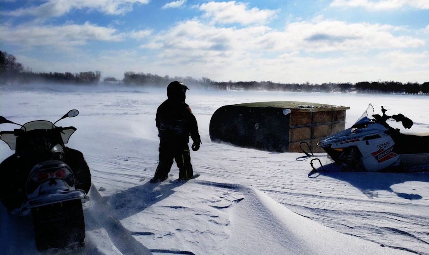 A Chisago County sheriff's deputy zipped out Sunday to a toppled icehouse on Green Lake.