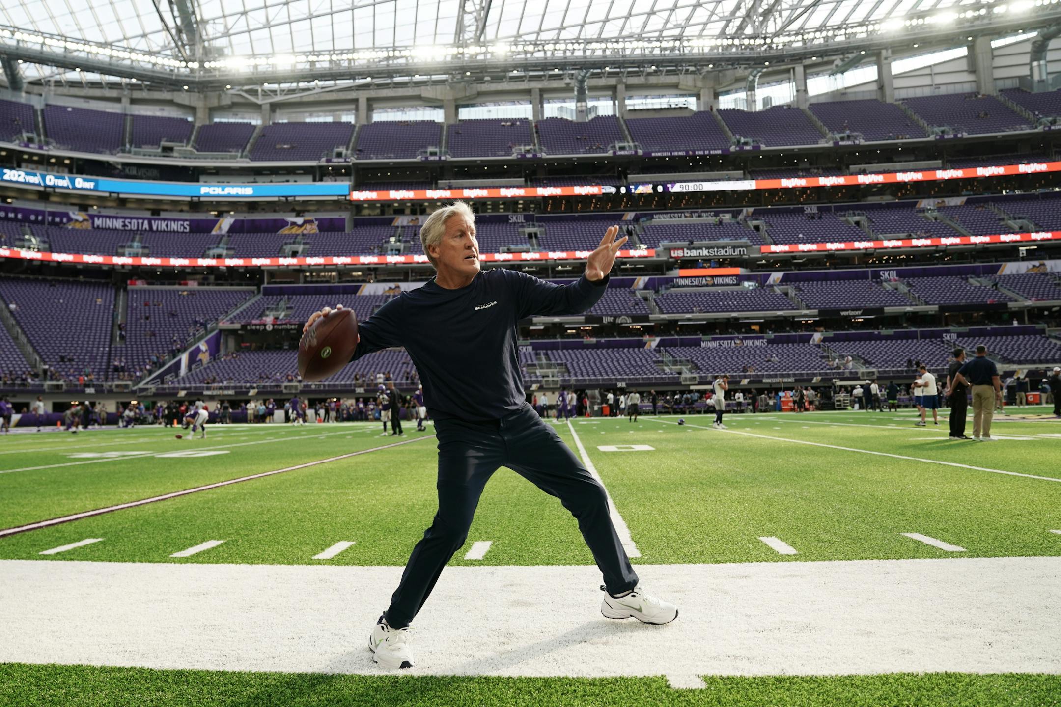 Seattle Seahawks head coach Pete Carroll played catch on the sidelines ahead of Sunday night's game against the Minnesota Vikings.