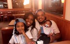 Chad Robertson of Minneapolis, pictured with his girlfriend and two children, was shot and wounded by an Amtrak police officer in Chicago Wednesday.
