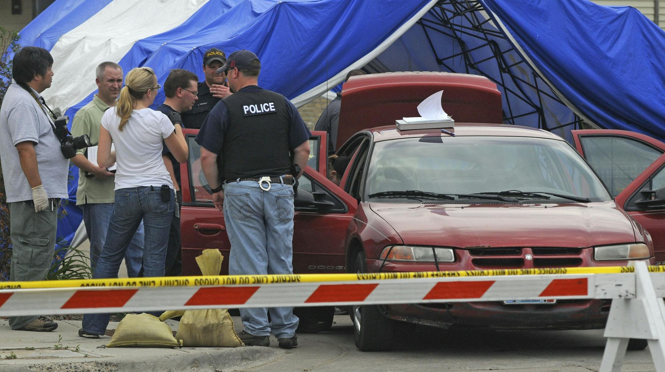 Chaska Police and the Minnesota Bureau of Criminal Apprehension (BCA) are investigating an altercation at Kelly's Bar early Friday morning that led to the death of a man. This car is in the parking lot of Kelly's Bar and police have been searching the trunk and interior.