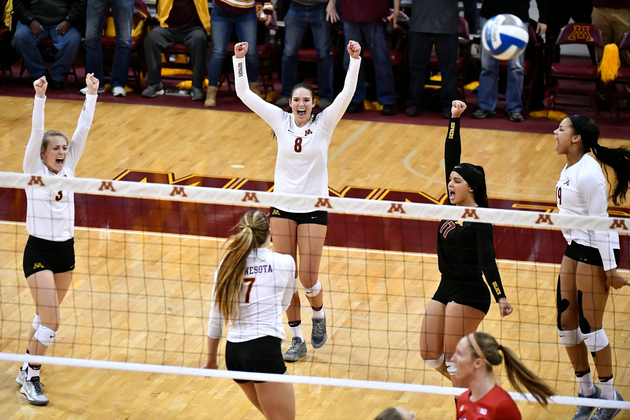 The Minnesota Golden Gophers celebrated after winning the third set over Nebraska.