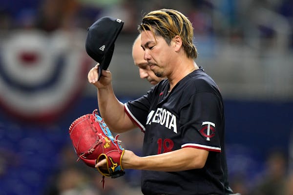 Minnesota Twins starting pitcher Kenta Maeda of Japan leaves the game during the sixth inning of a baseball game against the Miami Marlins, Tuesday, A