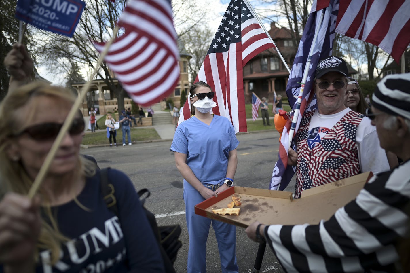 A woman, who identified herself as a registered nurse in a local emergency room, was taunted by a few protestors Saturday outside the Governor's Mansion in St. Paul. ] aaron.lavinsky@startribune.com A protest to open up the state, organized by the 3% United Patriots group, was held outside the governor's mansion on Saturday, April 25, 2020 in St. Paul, Minn.