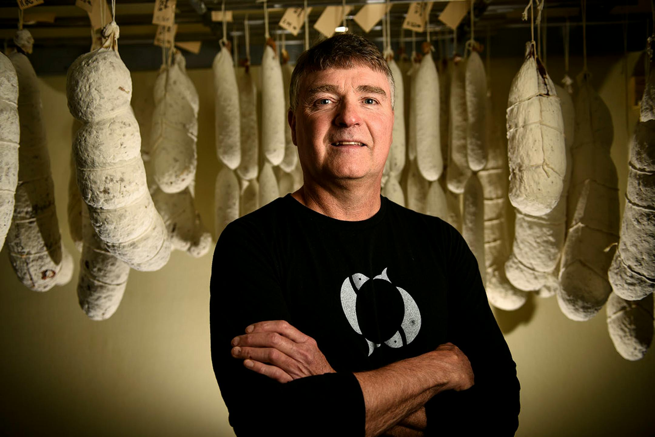 Northern Waters Smokehouse owner Eric Gordt in his sausage aging room Thursday.