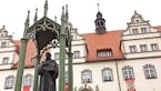 A statue of Martin Luther looks over Wittenberg's main Market Square. This year marks the 500th anniversary of Luther's public plea that triggered the