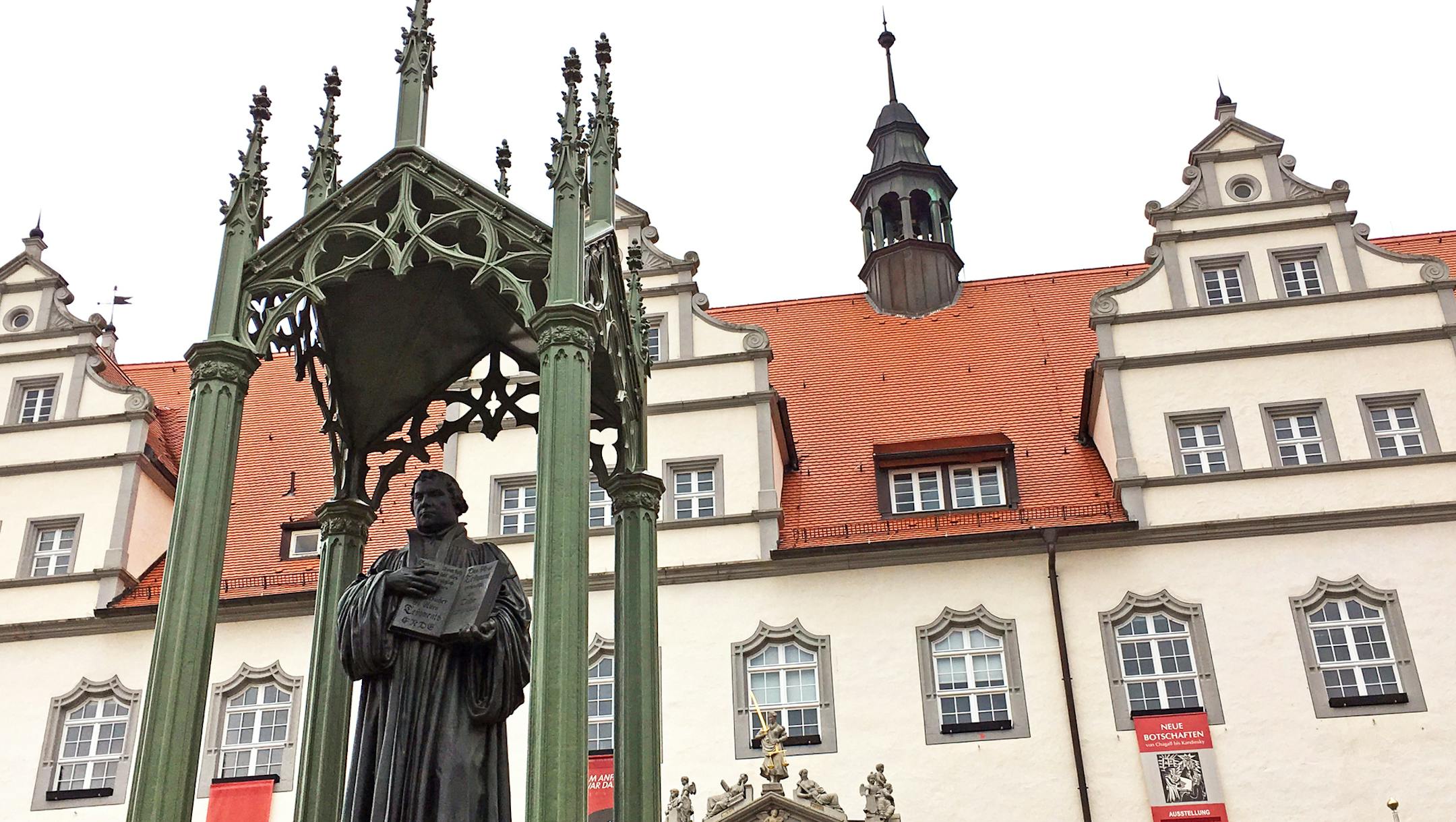 A statue of Martin Luther looks over Wittenberg's main Market Square. This year marks the 500th anniversary of Luther's public plea that triggered the Protestant Reformation. MUST CREDIT: Photo by Eliot Stein, Special to the Washington Post. ORG XMIT: MIN1706281407318073