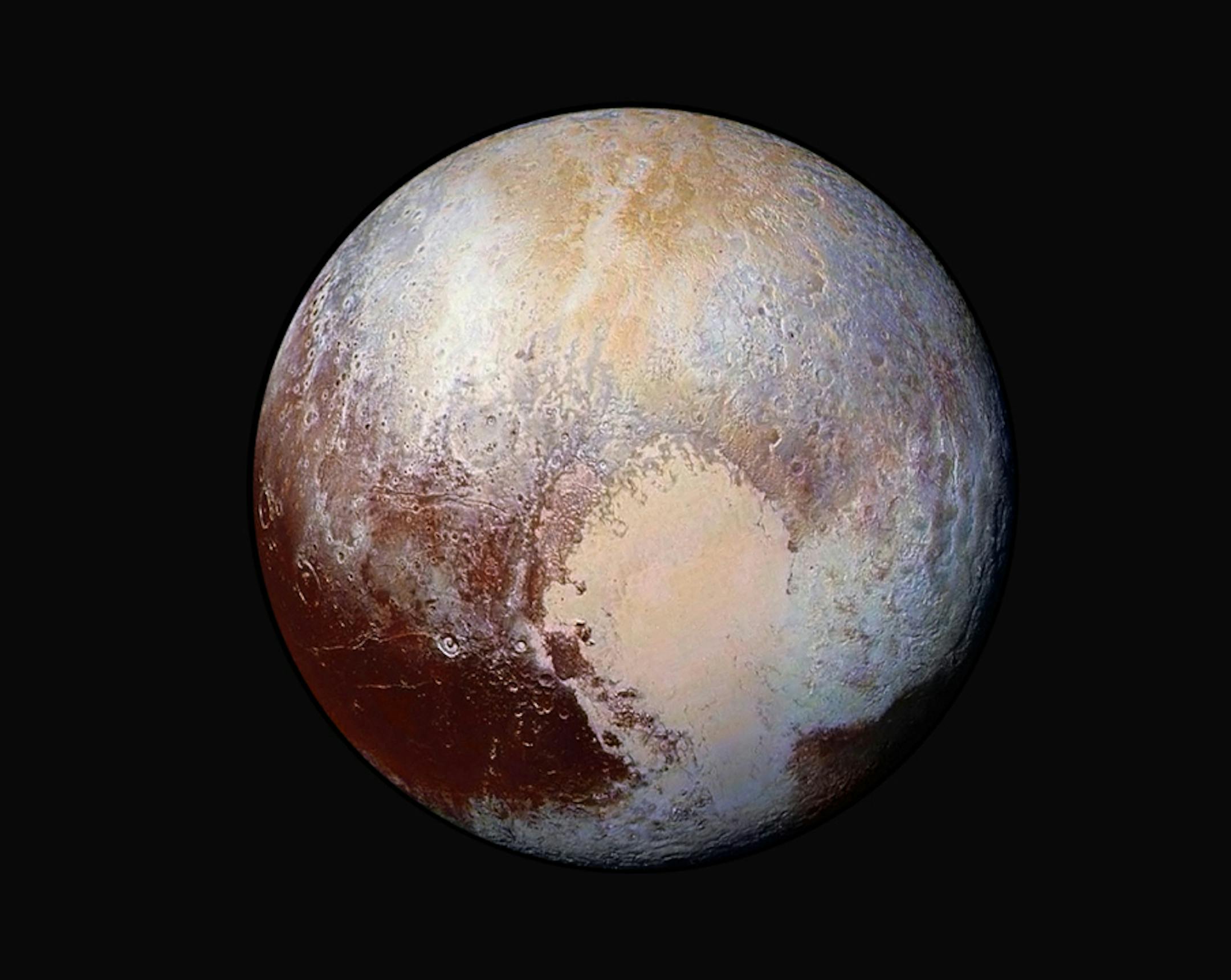 This image made available by NASA on Friday, July 24, 2015 shows a combination of images captured by the New Horizons spacecraft with enhanced colors to show differences in the composition and texture of Pluto's surface. The images were taken when the spacecraft was 280,000 miles (450,000 kilometers) away. (NASA/JHUAPL/SwRI via AP)