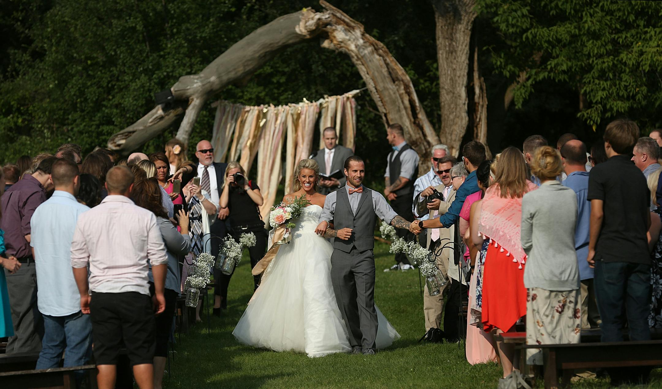 Newlyweds Savannah and Jeremy Eckert were greeted by friends and family following the ceremony.