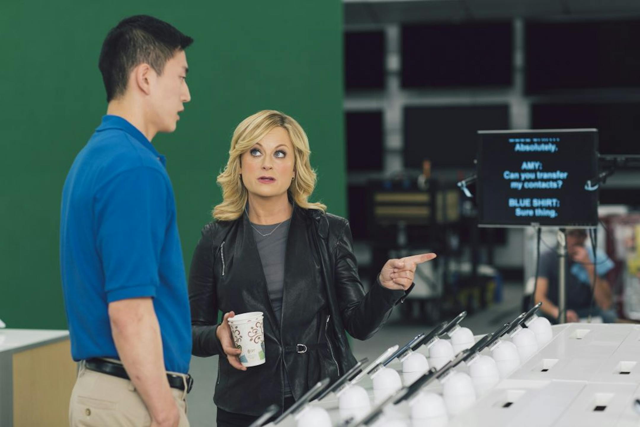 This undated image provided by Best Buy, shows Amy Poehler on the set of the Company's Super Bowl commercial. Best Buy's 30-second ad in the first quarter stars Amy Poehler, star of NBC's "Parks and Rec," asking a Best Buy employee "lots of questions."
