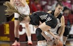 Farmington's Peyton Blandin and Eden Prairie's Myra Moorjani battled for the rebound during the second half of their match up in the Class 4A girls' b