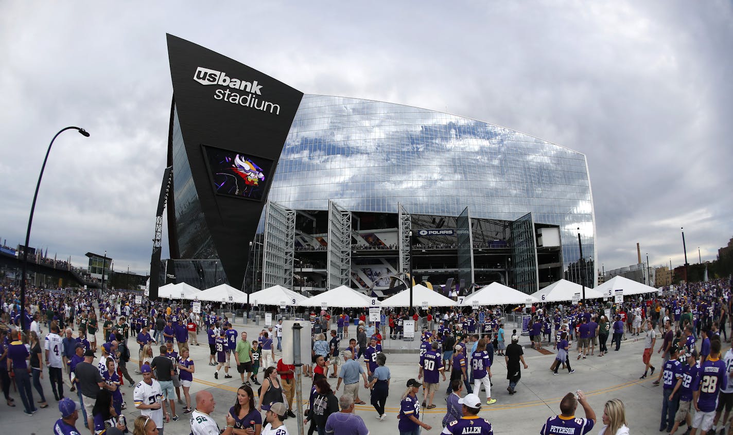 Fans outside of US bank Stadium before Sunday night's game between the Minnesota Vikings and Green Bay Packers. ] CARLOS GONZALEZ cgonzalez@startribune.com - September 18, 2016, Minneapolis, MN, US Bank Stadium, NFL, Minnesota Vikings vs. Green Bay Packers ORG XMIT: MIN1609181847420822