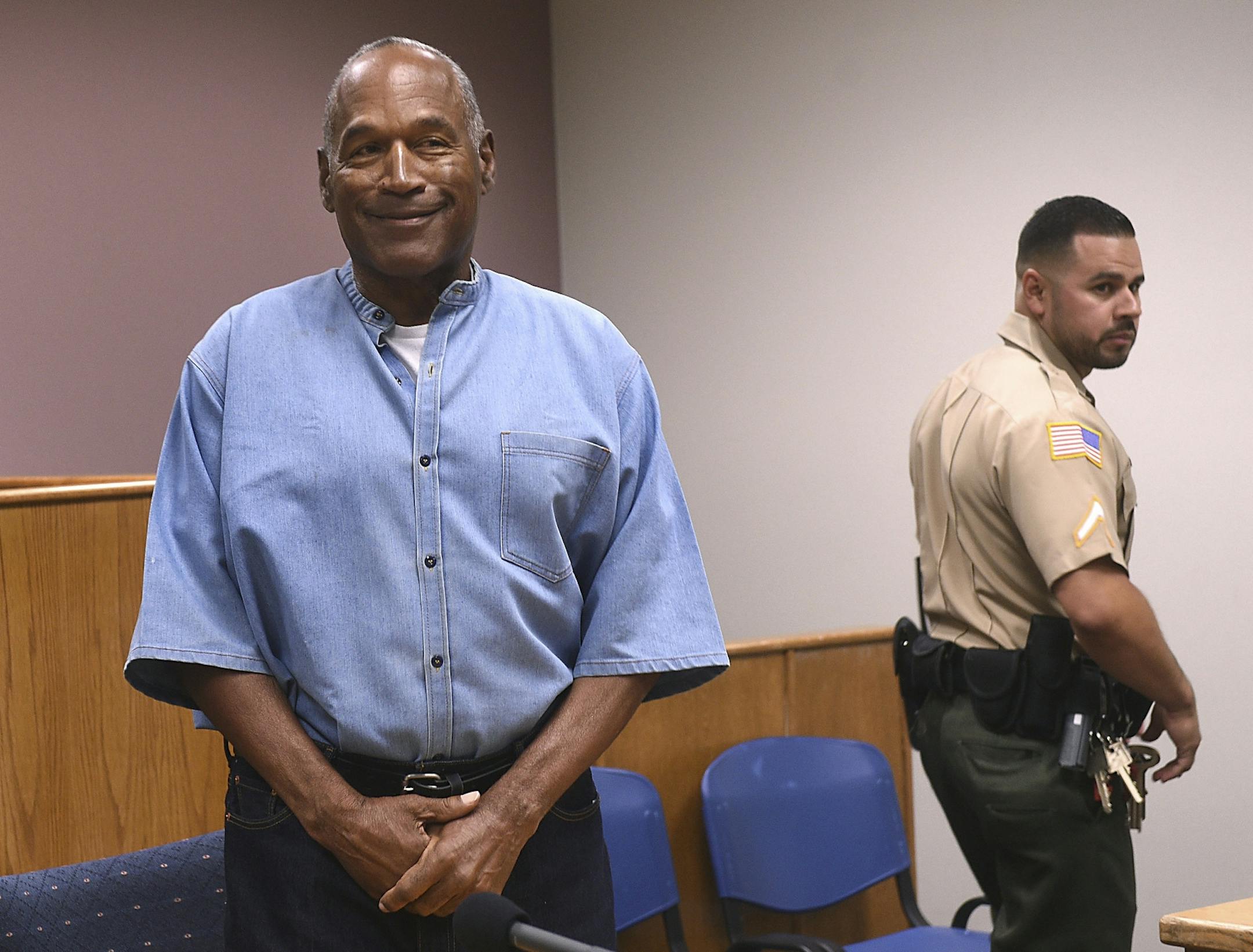 Former NFL football star O.J. Simpson enters for his parole hearing at the Lovelock Correctional Center in Lovelock, Nev., on Thursday, July 20, 2017. Simpson was convicted in 2008 of enlisting some men he barely knew, including two who had guns, to retrieve from two sports collectibles sellers some items that Simpson said were stolen from him a decade earlier.