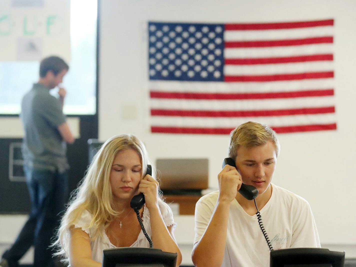 Siblings Chelsea Montgomery, 18, and Chris Montgomery, 15, worked the phones at the Congressional Leadership Fund headquarters in Bloomington.