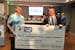 Minnesota United goalkeeper Matt Lampson (left) received a $10,000 check on behalf of his foundation from Bell Bank President Michael Solberg.
