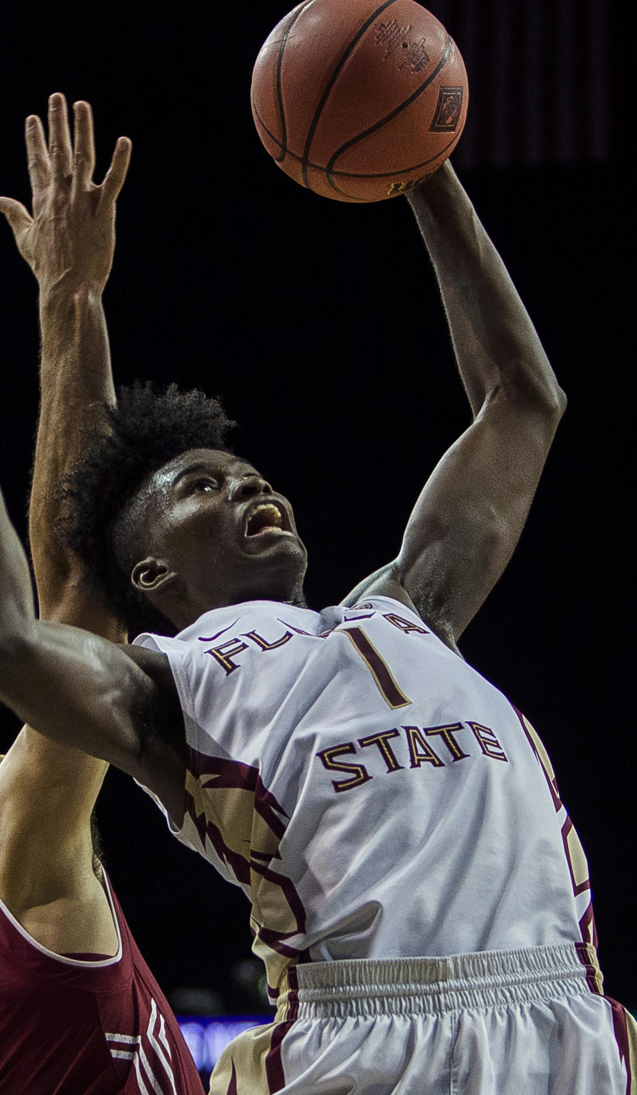 Florida State's Jonathan Isaac (1) misses his shot covered by Temple's Obi Enechionyia (0) during an NCAA college basketball game in the semifinals of the NIT Season Tip-Off tournament in New York, Thursday, Nov. 24, 2016. (AP Photo/Andres Kudacki)