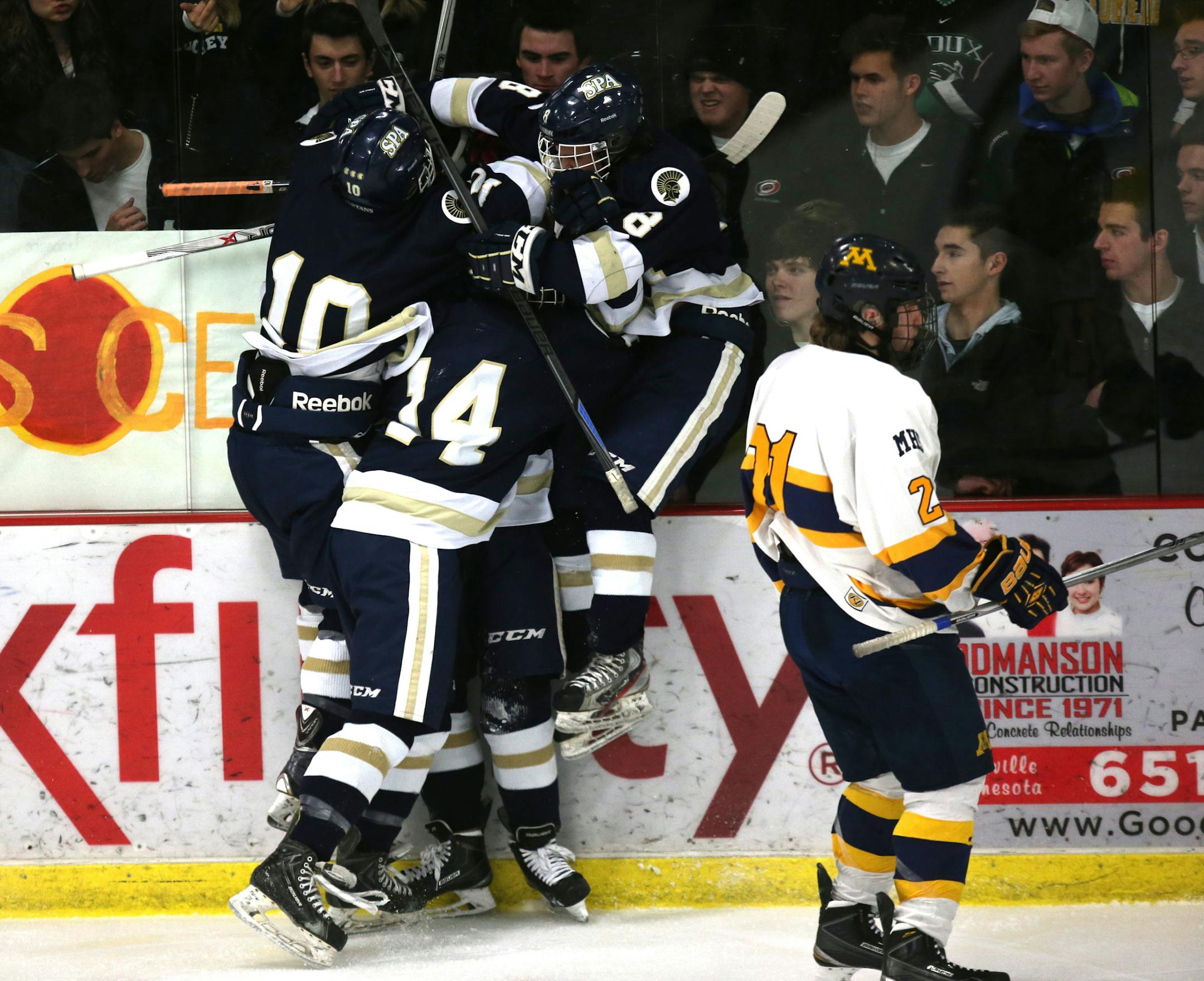 St. Paul Academy after Cullen McCabe scored their first goal in the first period. ] (KYNDELL HARKNESS/STAR TRIBUNE) kyndell.harkness@startribune.com St. Paul Academy vs Mahtomedi in sectional finals in Roseville , Min., Friday, February 27, 2015.
