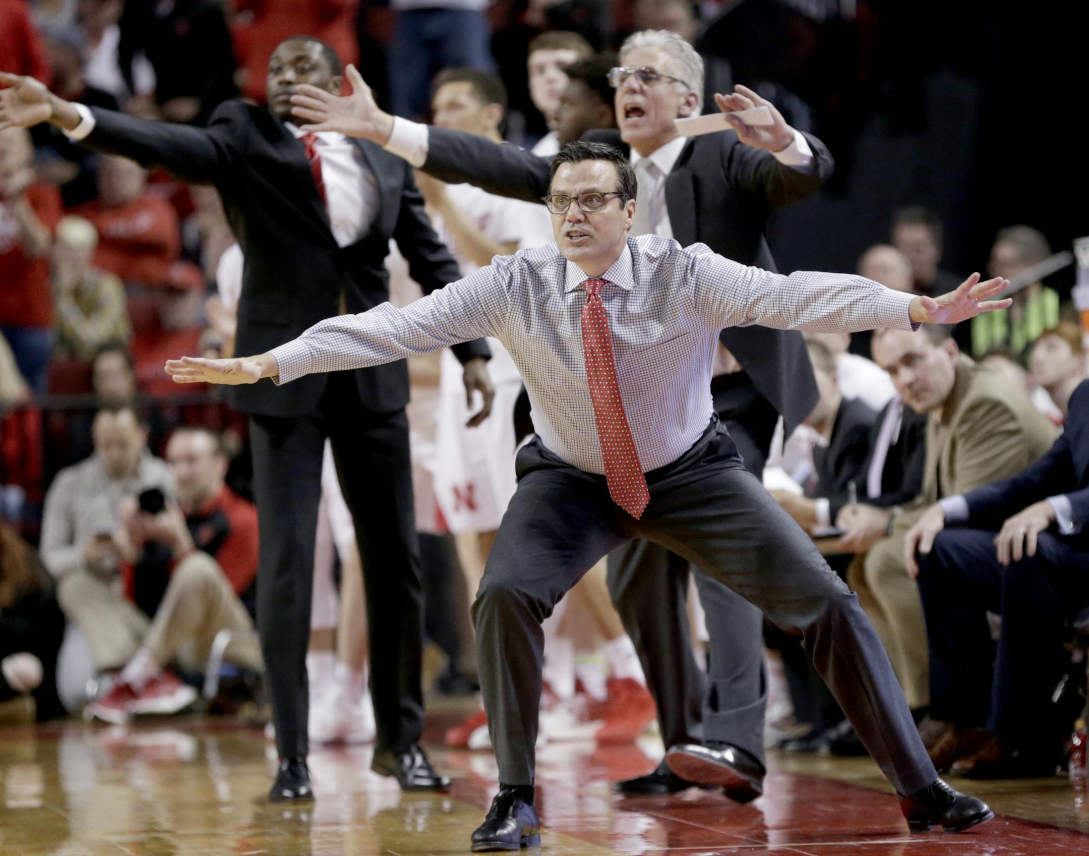 FILE - In this Jan. 10, 2019, file photo, Nebraska coach Tim Miles and members of his staff gesture during the second half of an NCAA college basketball game against Penn State, in Lincoln, Neb. Nebraska has fired seventh-year coach Tim Miles after the Cornhuskers finished 13th in the Big Ten and failed to make the NCAA Tournament for a fifth straight year. Athletic director Bill Moos announced the firing Tuesday, March 26, 2019, two days after the Huskers finished a 19-17 season with an 88-72 l
