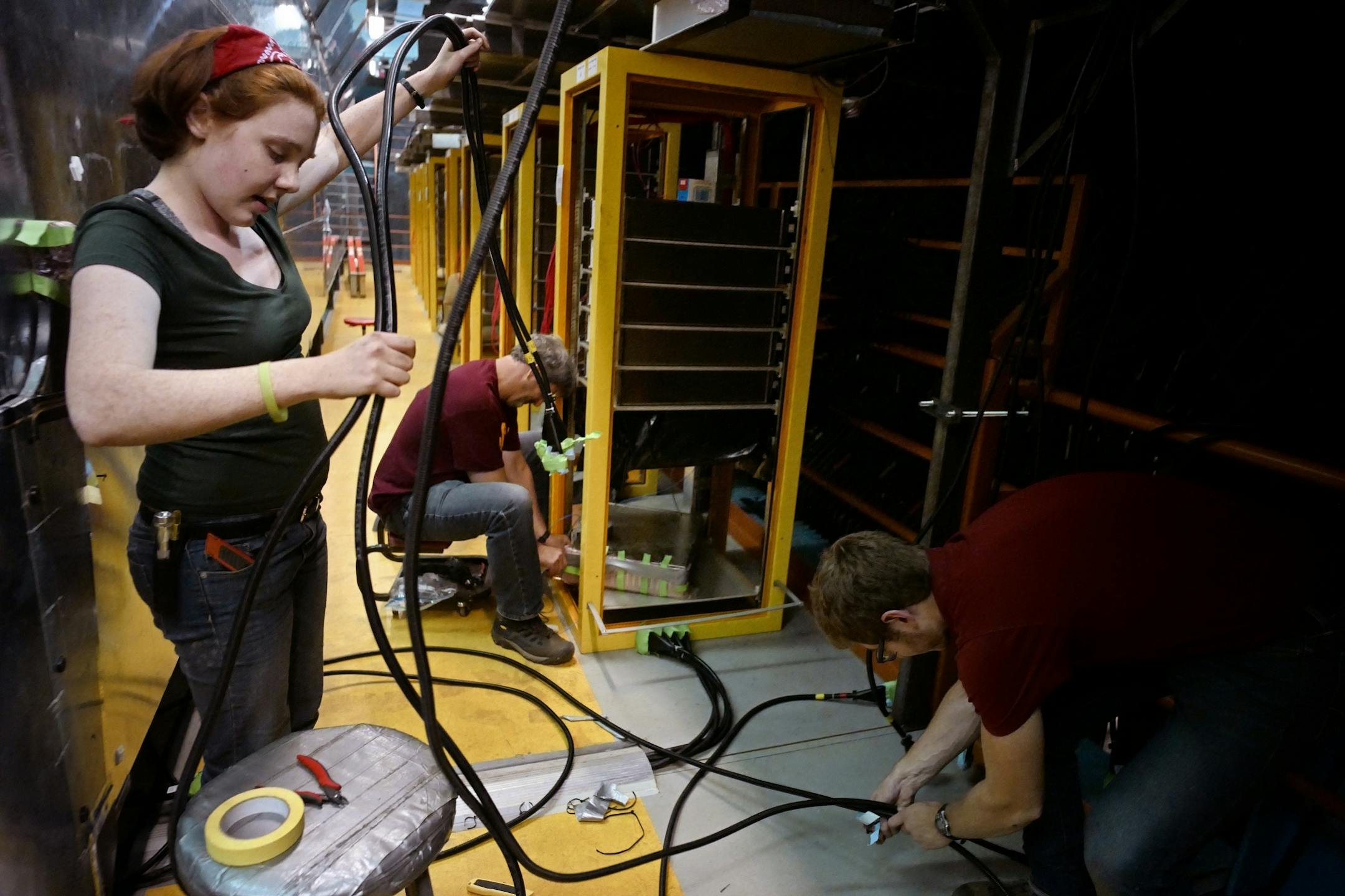 Northwestern student and intern Emma McDonnell collects fiber optic cables that will be used in other experiments.