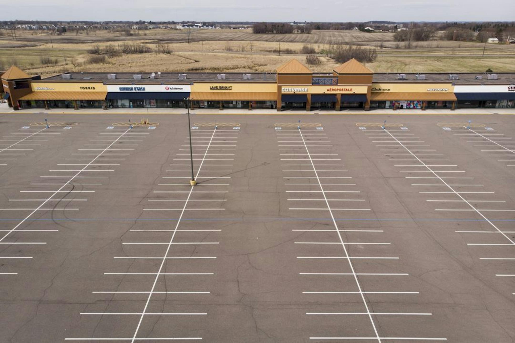 The parking lot at the Albertville Premium Outlets was empty Saturday afternoon as businesses remain closed due to the coronavirus.