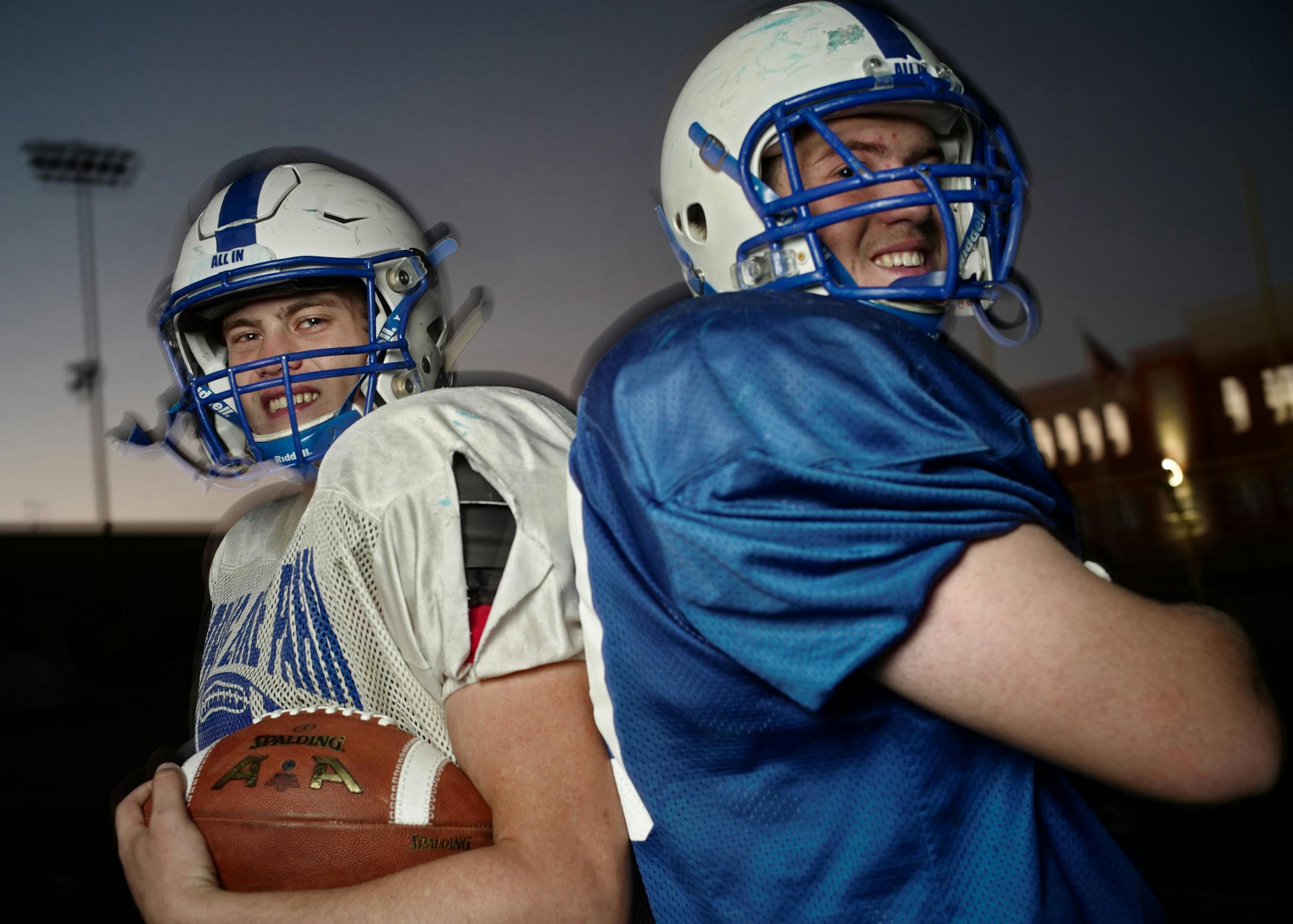 Spring Lake Park quarterback Zach Ojile, left, has gained much of his 3,610 career yards rushing behind his 6-2, 270-pound twin brother, Josh, a workout warrior.
