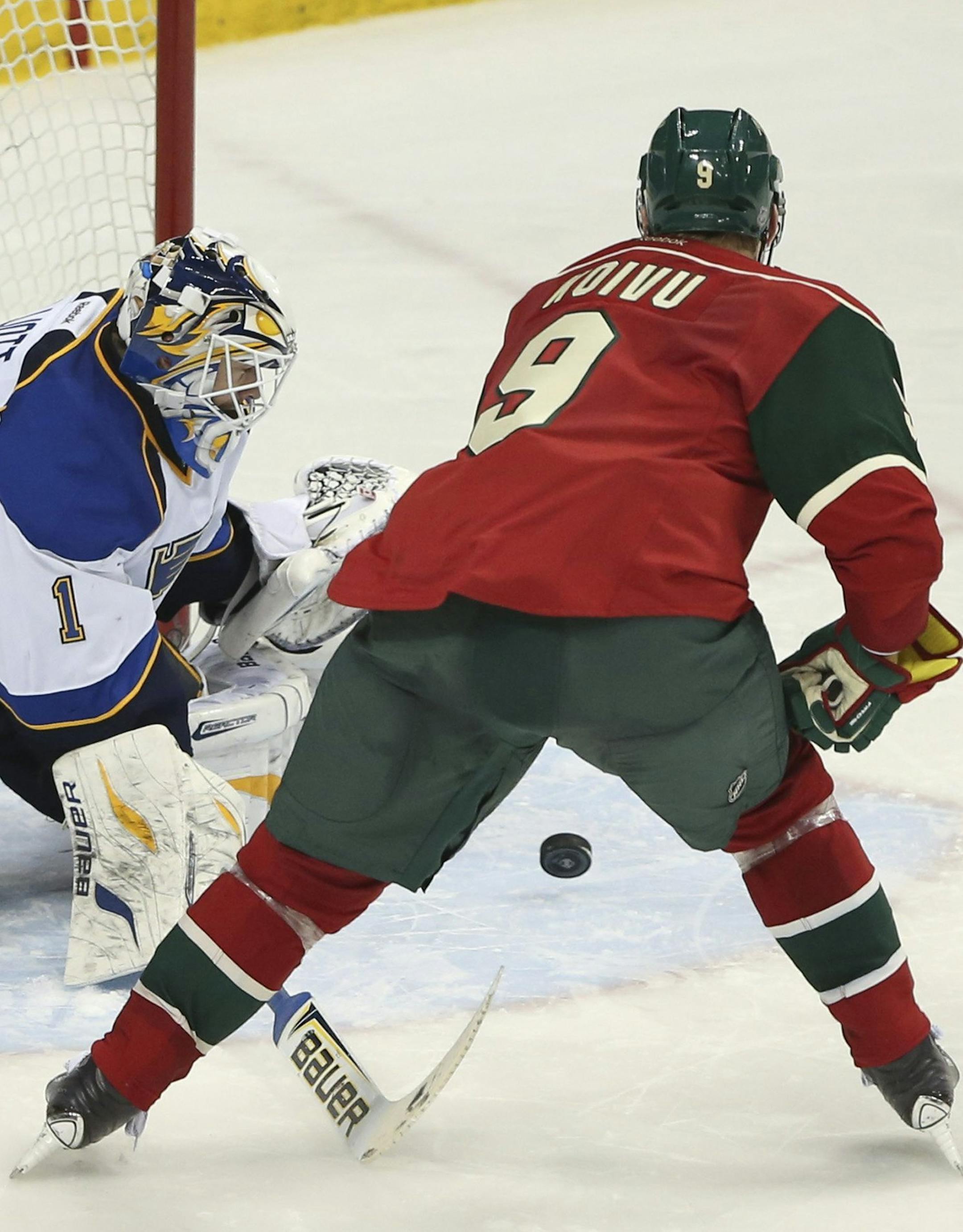 St. Louis Blues goalie Brian Elliott (1) stops a Minnesota Wild center Mikko Koivu (9) from scoring during the shootout at Xcel Energy Center in St. Paul, Minn., on Sunday, March 9, 2014. (Jeff Wheeler/Minneapolis Star Tribune/MCT)