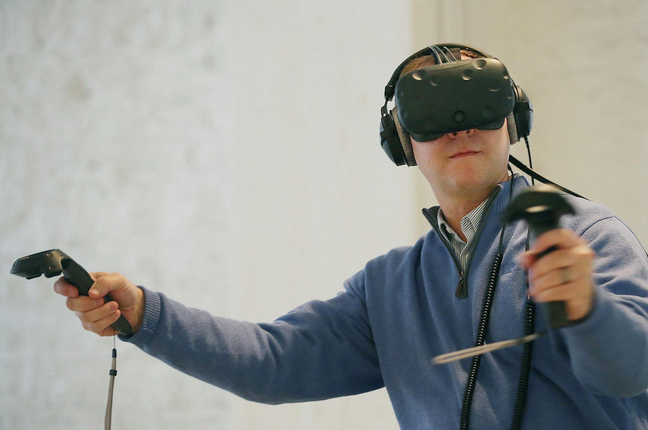 Adam Dresen, cq, a visitor to Space150, tested out the HTC Vive at the ad agency, Monday, February 29, 2016 in downtown Minneapolis, MN. Space150, an ad agency that is exploring what it and other headsets can mean for the marketing industry, invited others from the building to test the headsets for a few hours. ] (ELIZABETH FLORES/STAR TRIBUNE) ELIZABETH FLORES &#x2022; eflores@startribune.com