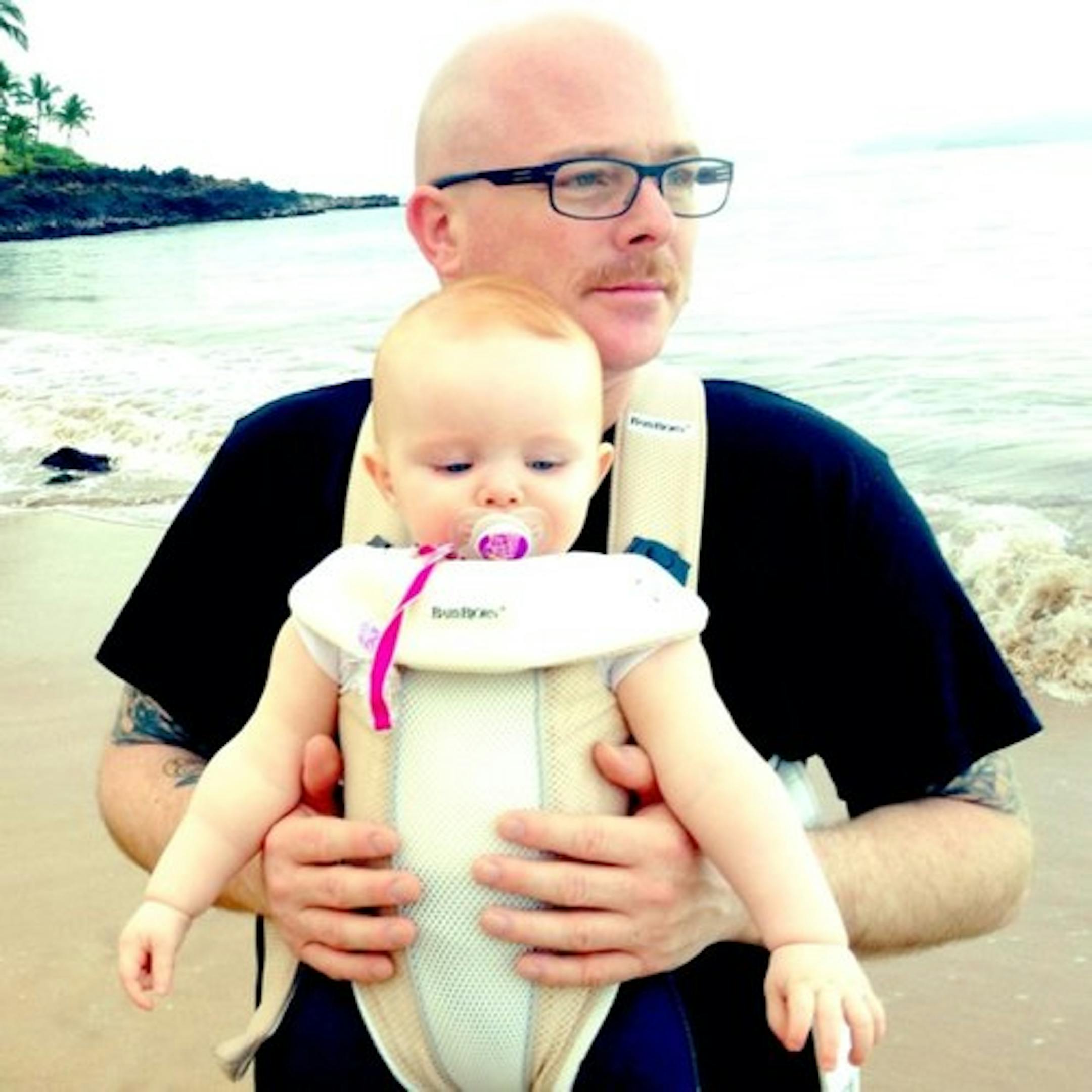 Jason "J-Bird" Cook, the longtime Rhymesayers staffer who spearheaded Soundset, with his daughter.