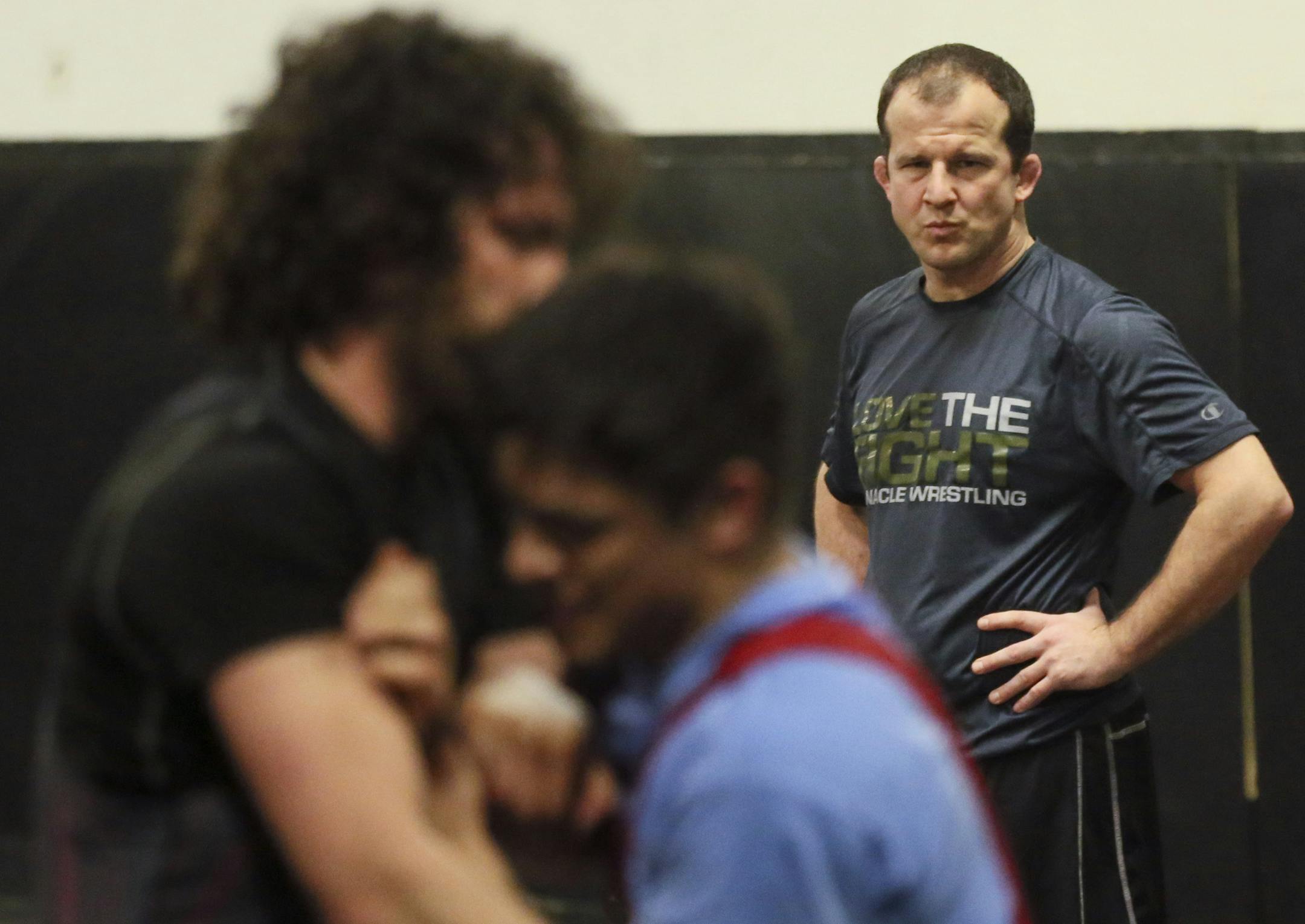 Story about how wrestling was almost kicked out of the Olympics in 2013--if it had been, this would have been the last Olympic trials ever. But they saved it, on condition that they make some changes to the rules to make the sport more exciting. Here, former Olympian and coach Brandon Paulson, works with wrestlers at his Pinnacle training facility in Shoreview.] Brian.Peterson@startribune.com Shoreview, MN - 03/31/2016