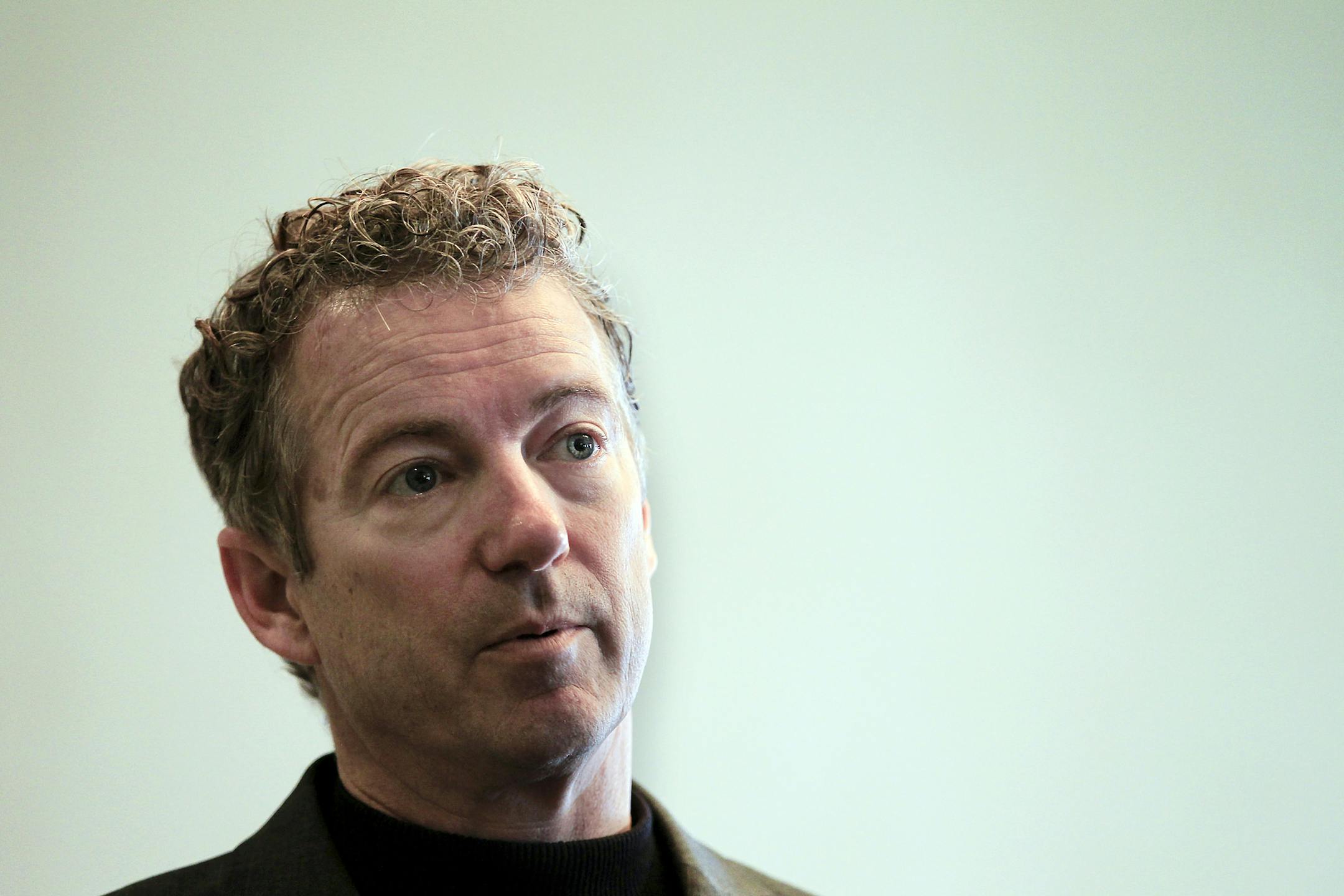 Sen. Rand Paul, R-Ky., listens to a question at the Epoch Restaurant in Exeter, N.H., Saturday, March 21, 2015. Paul is traveling through New Hampshire this weekend, hosting several events with local leaders, business owners and activists. (AP Photo/Cheryl Senter)