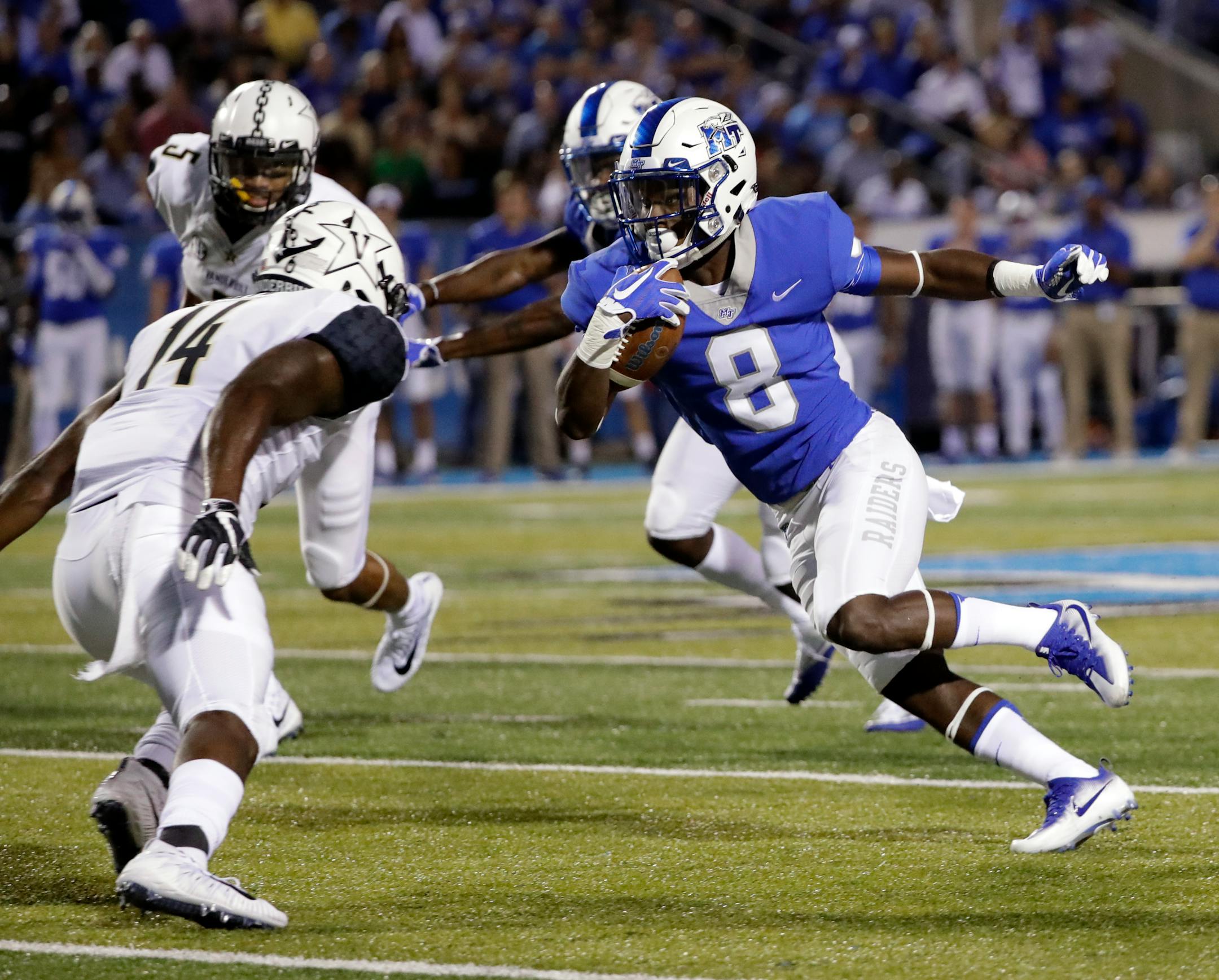 Middle Tennessee wide receiver Ty Lee (8) runs against Vanderbilt safety Ryan White (14) in the first half of an NCAA college football game Saturday, Sept. 2, 2017, in Murfreesboro, Tenn. (AP Photo/Mark Humphrey)