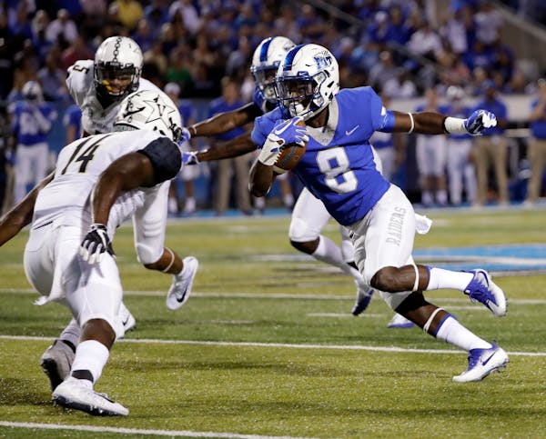 Middle Tennessee wide receiver Ty Lee (8) runs against Vanderbilt safety Ryan White (14) in the first half of an NCAA college football game Saturday, 