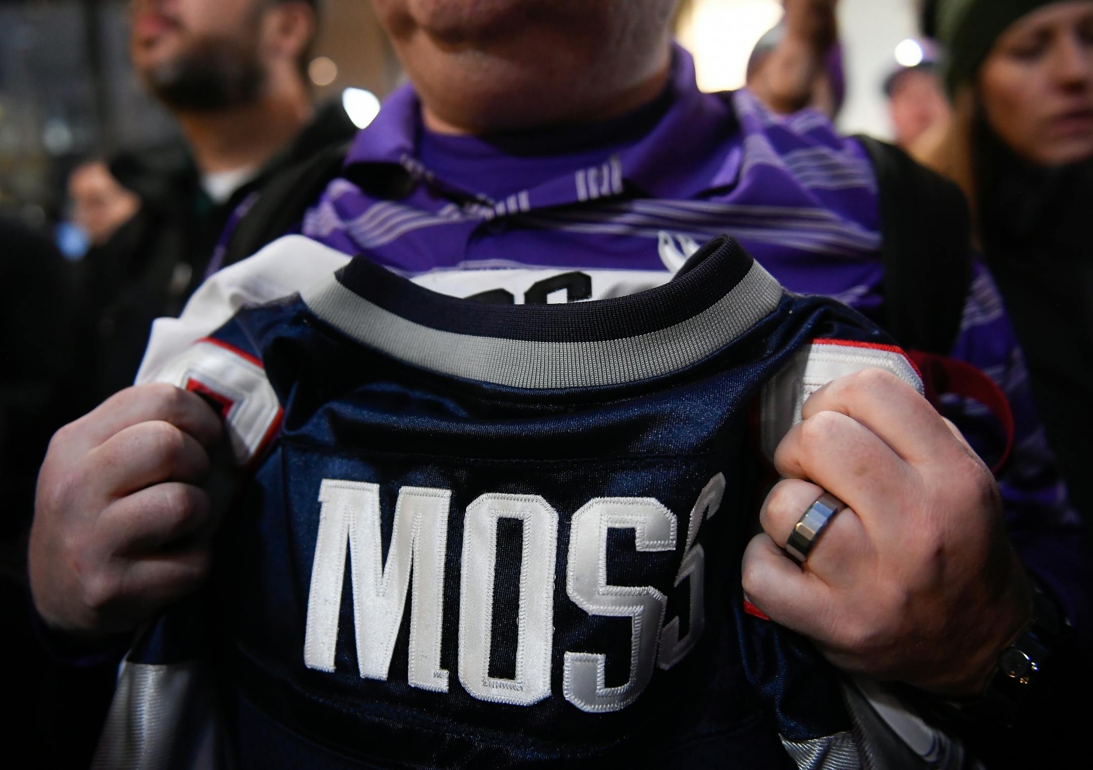 Curt Godejohn, of Ramsey, clenched a couple of Randy Moss jerseys that he was hoping to have autographed Thursday by Moss at the IDS Center.