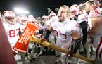 Wisconsin defensive end Jake Keefer took Paul Bunyan's Axe to one of the goal posts after Wisconsin defeated Minnesota 31-21 at TCF Bank Stadium, Satu