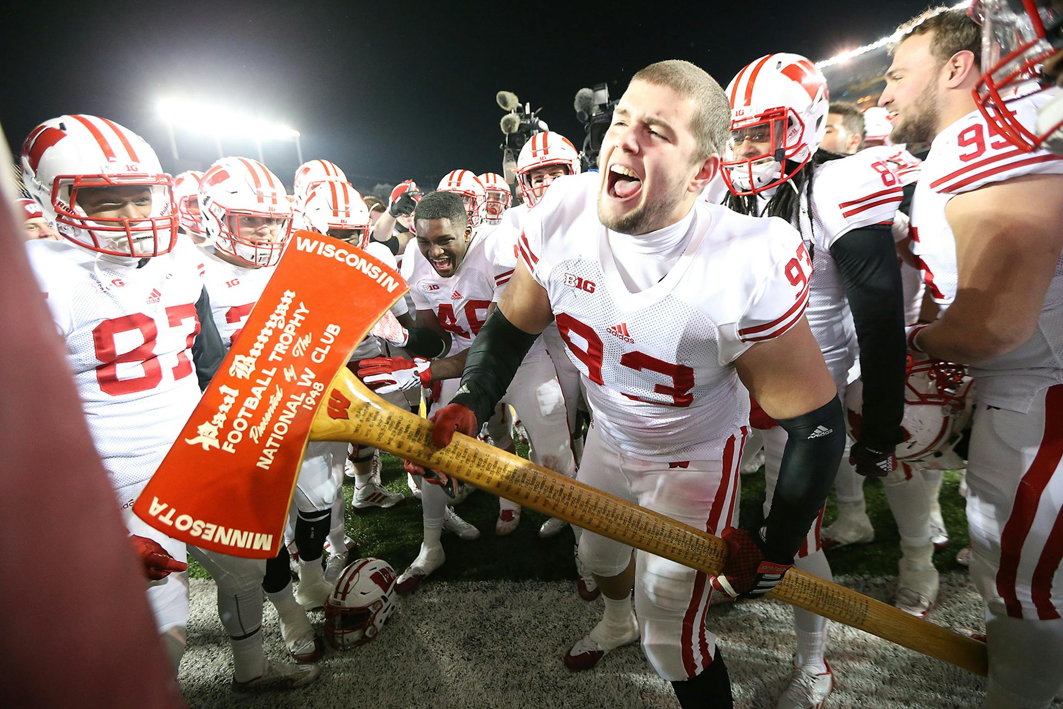 Wisconsin defensive end Jake Keefer took Paul Bunyan's Axe to one of the goal posts after Wisconsin defeated Minnesota 31-21 at TCF Bank Stadium, Saturday, November 28, 2015 in Minneapolis.