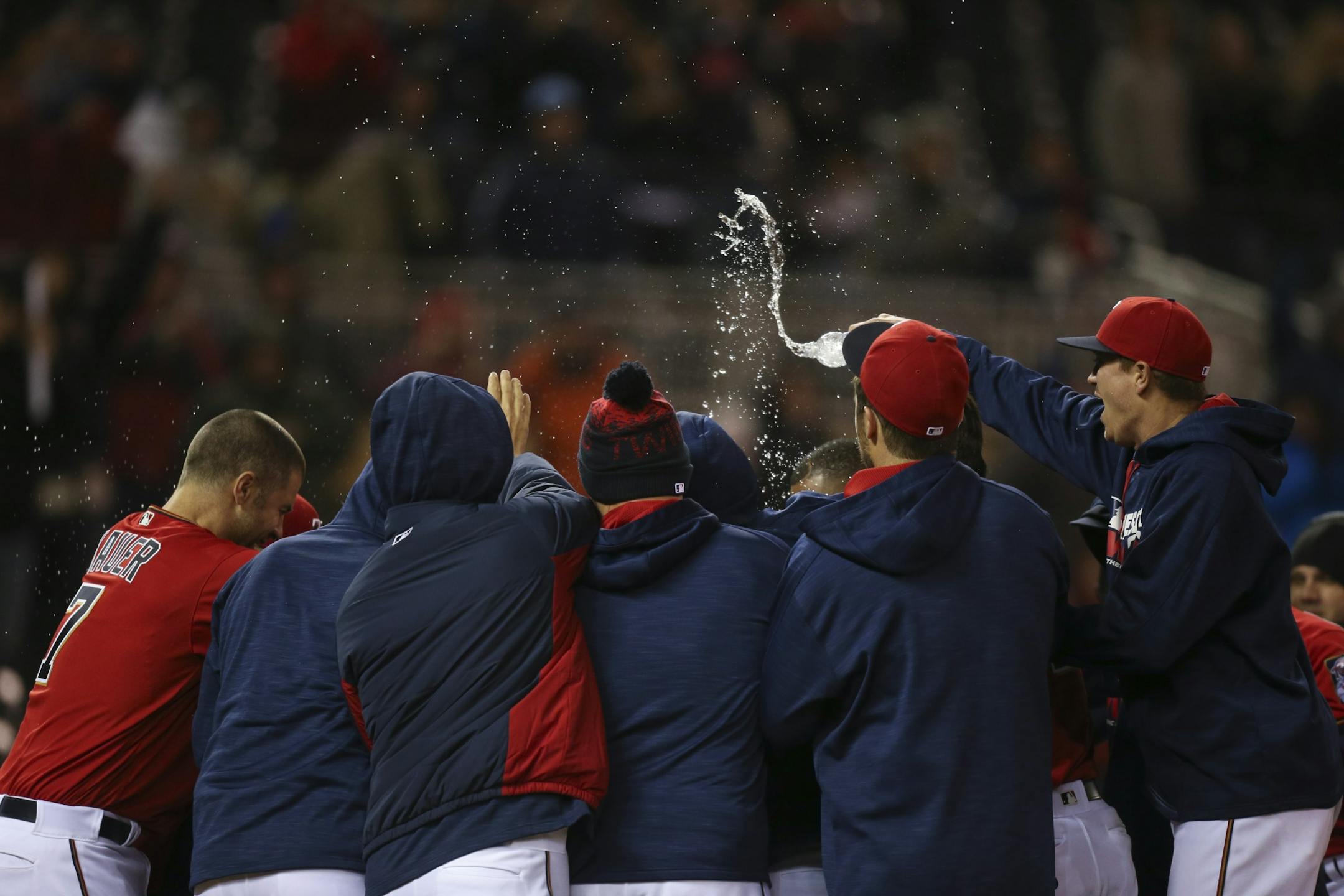 Teammates mobbed the Twins' Oswaldo Arcia at home plate after his walk off home run gave the Twins the win Monday night.