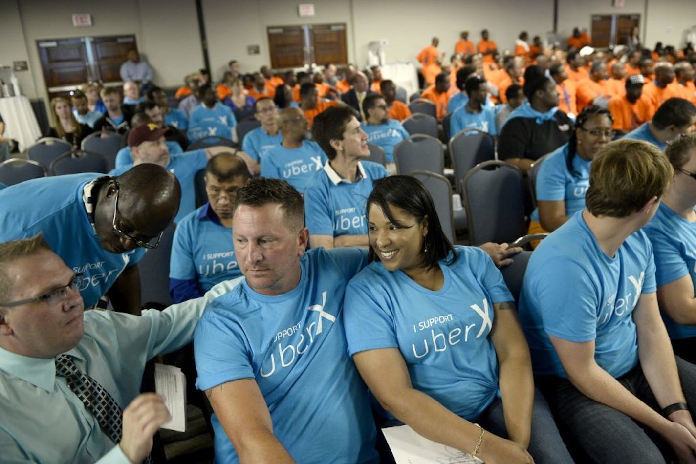 Uber drivers and supporters attend a public hearing on July 20, one of three held by the Metropolitan Airports Commission on proposed new rules for taxicabs and ride-sharing firms at the airport.