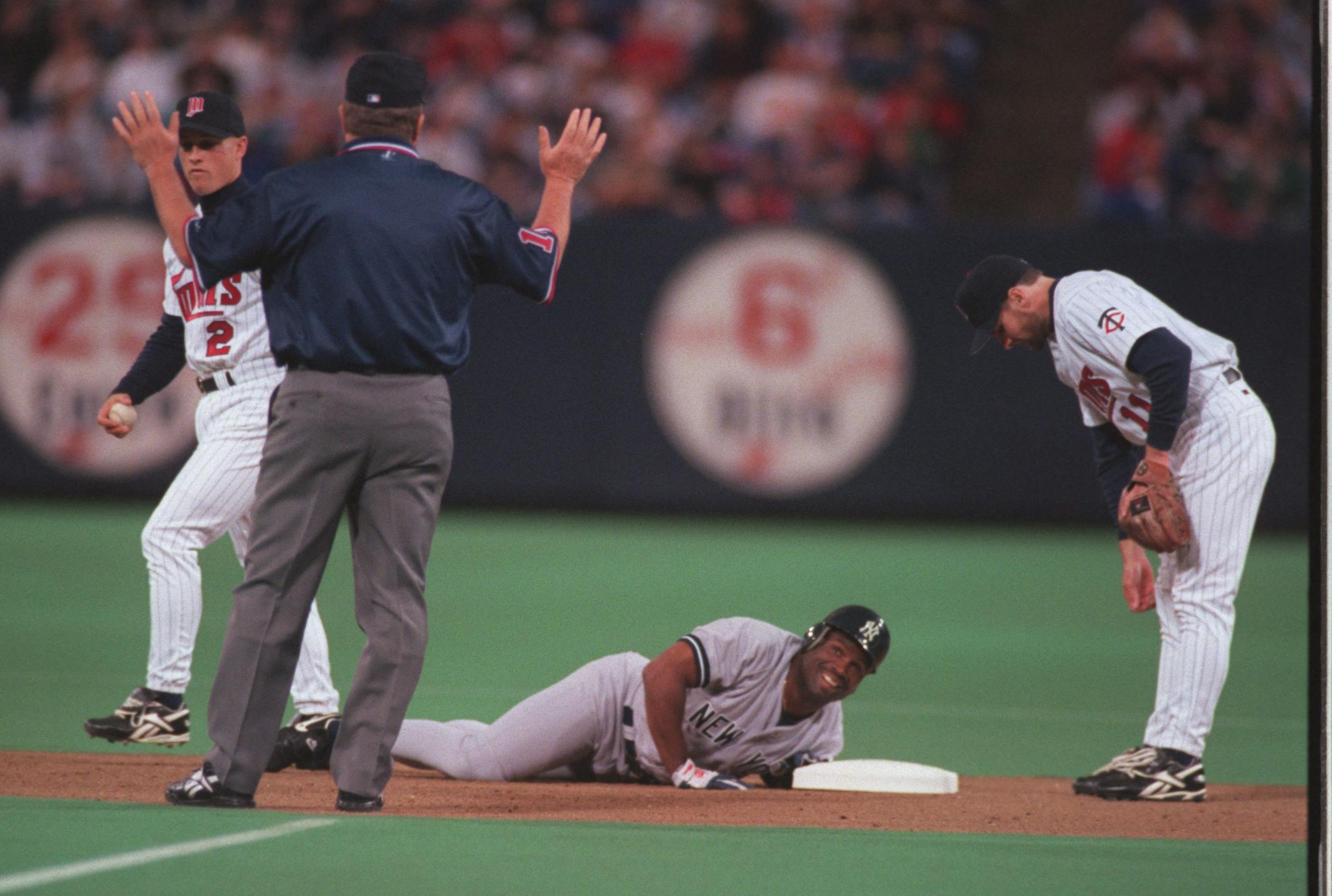 New York Yankee Tim Raines slides safely into second base during the first inning of their game against the Twins at the Metrodome Saturday evening.