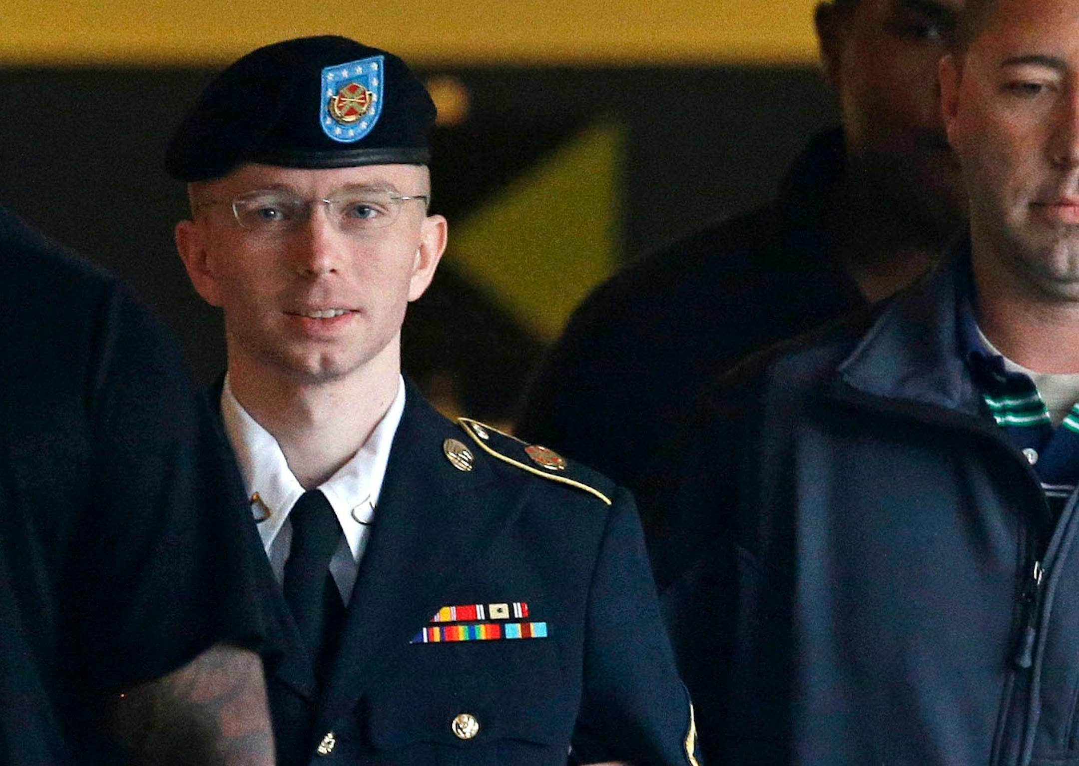 In this Monday, July 29, 2013, file photo, Army Pfc. Bradley Manning is escorted to a security vehicle outside of a courthouse in Fort Meade, Md. U.S. Army Pfc. Bradley Manning was acquitted Tuesday, July 30, 2013, of aiding the enemy for giving classified secrets to WikiLeaks.