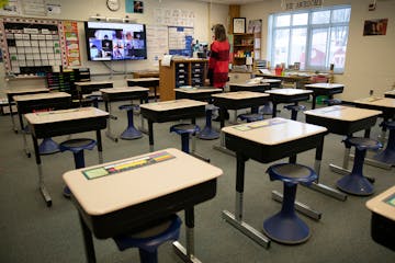 Fourth grade teacher Kelly Brant stands in her classroom as she talks to her students who were learning remotely Tuesday, Jan. 19, 2021 at Park Brook 